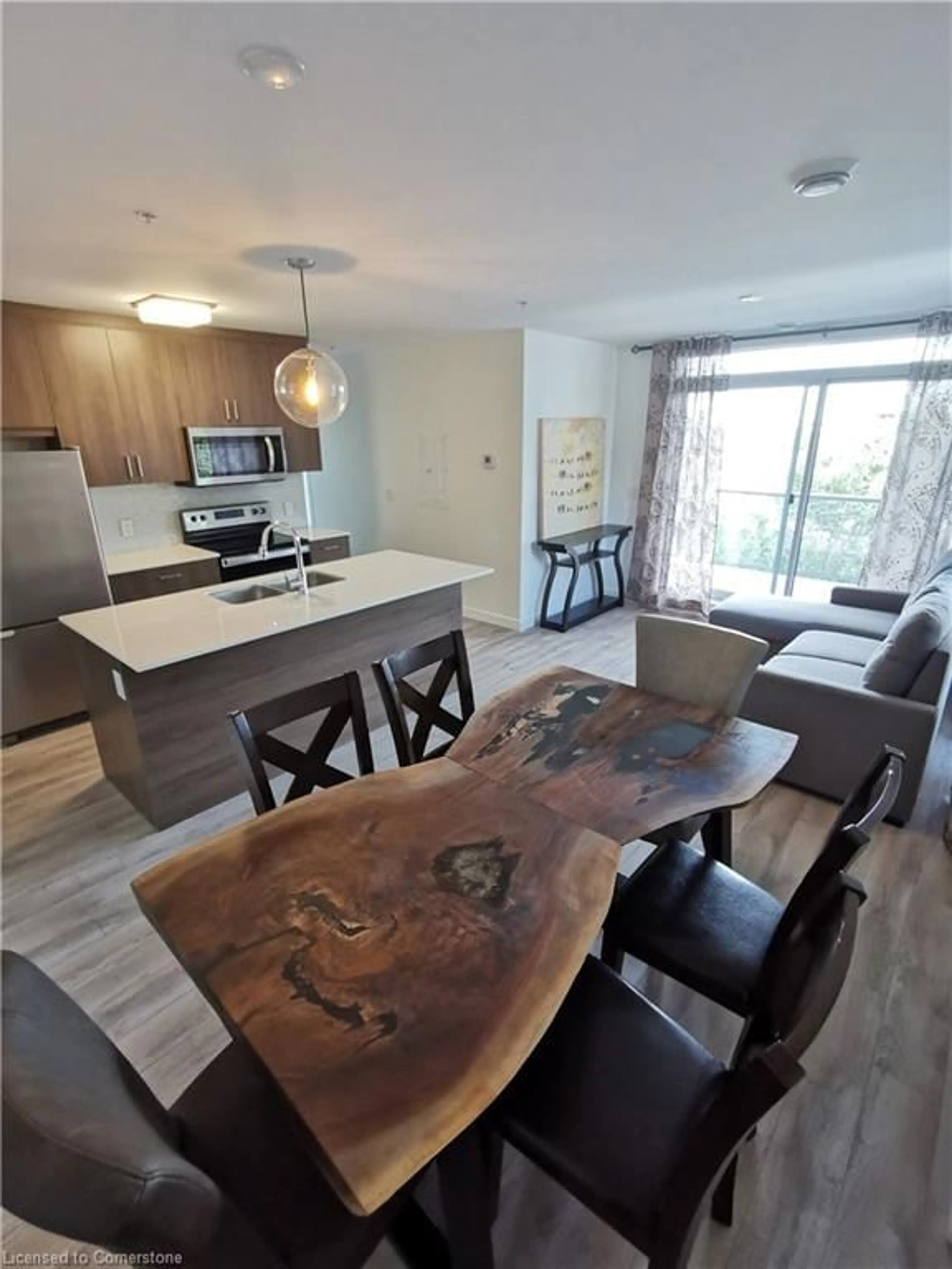 Open concept kitchen, wood/laminate floor for 467 Charlton Avenue East Ave #207, Hamilton Ontario L8N 0B3