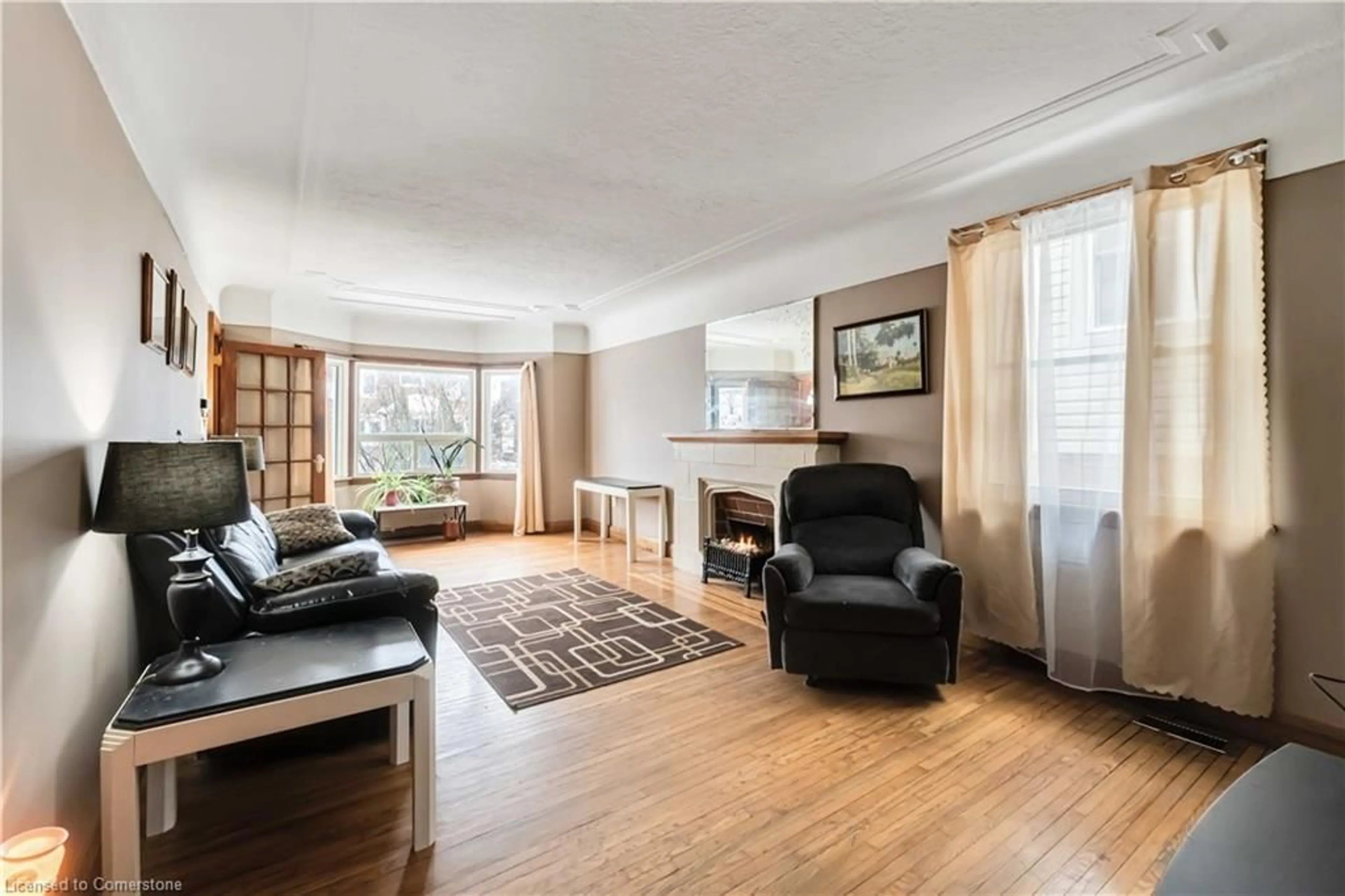 Living room with furniture, wood/laminate floor for 14 Huxley Ave, Hamilton Ontario L8K 2P6