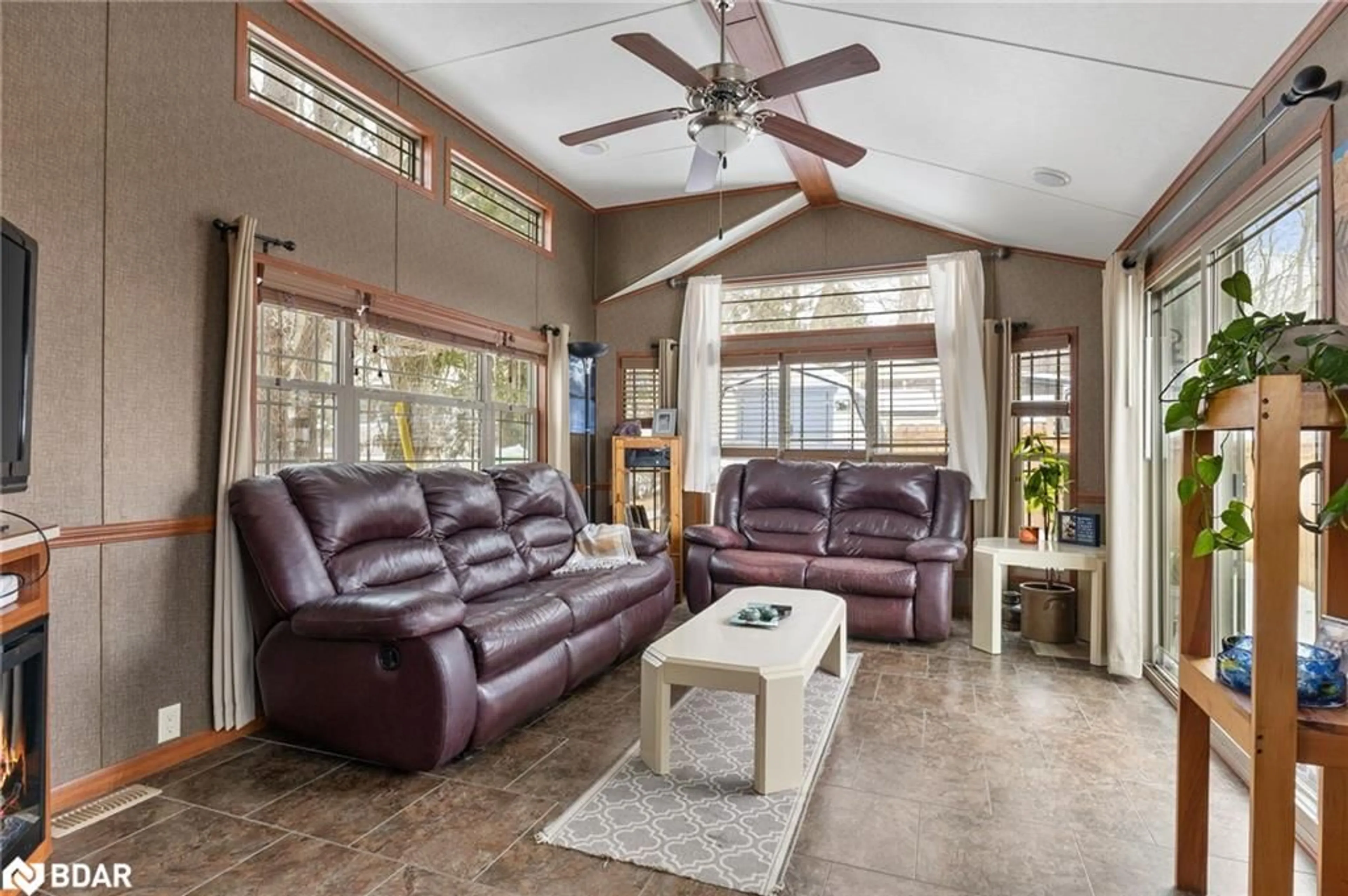 Living room with furniture, ceramic/tile floor for 5139 Halstead Beach Rd, Bewdley Ontario K0L 1E0