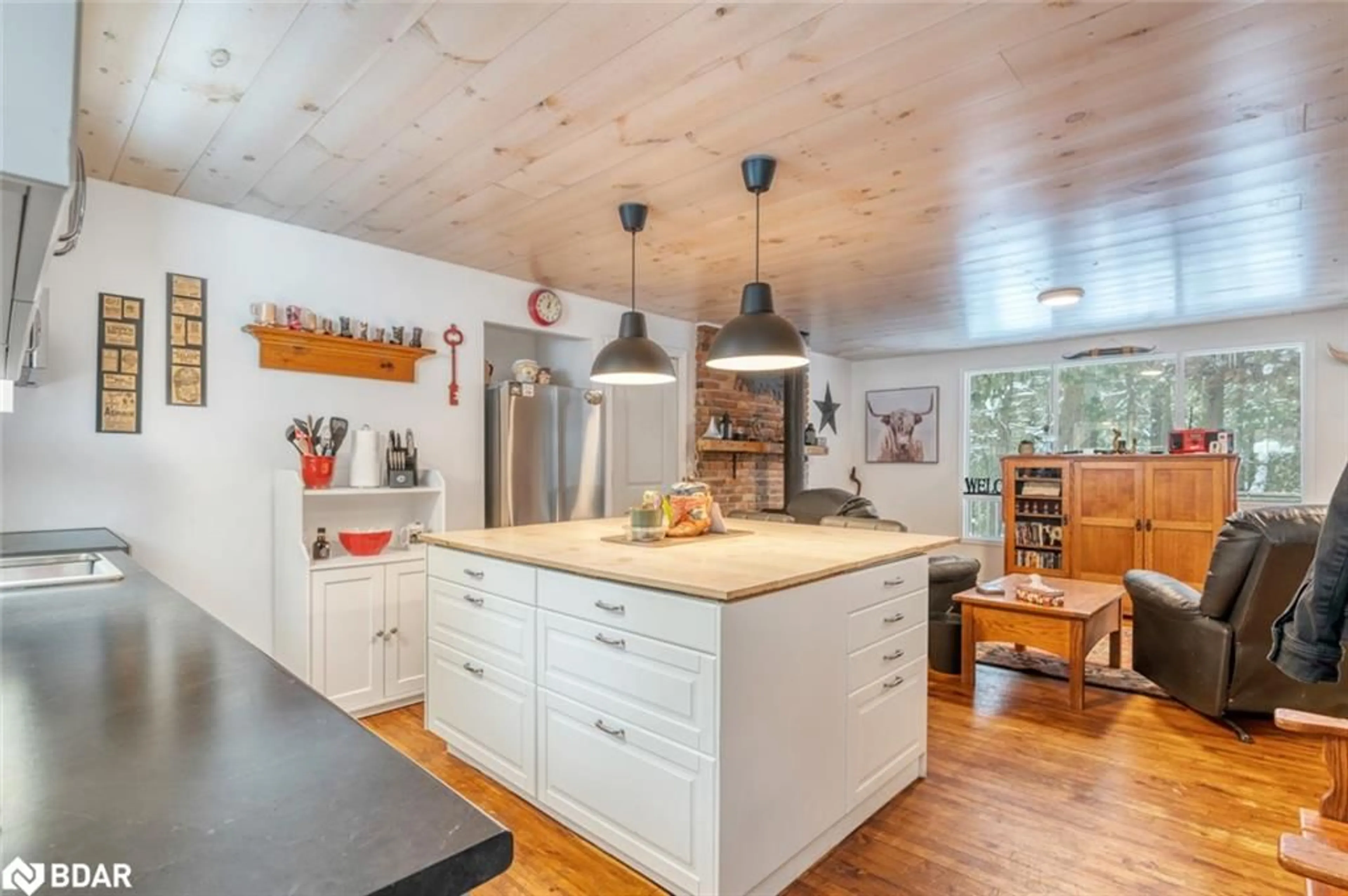 Open concept kitchen, wood/laminate floor for 493824 Baptist Church Road, Priceville Ontario N0C 1K0