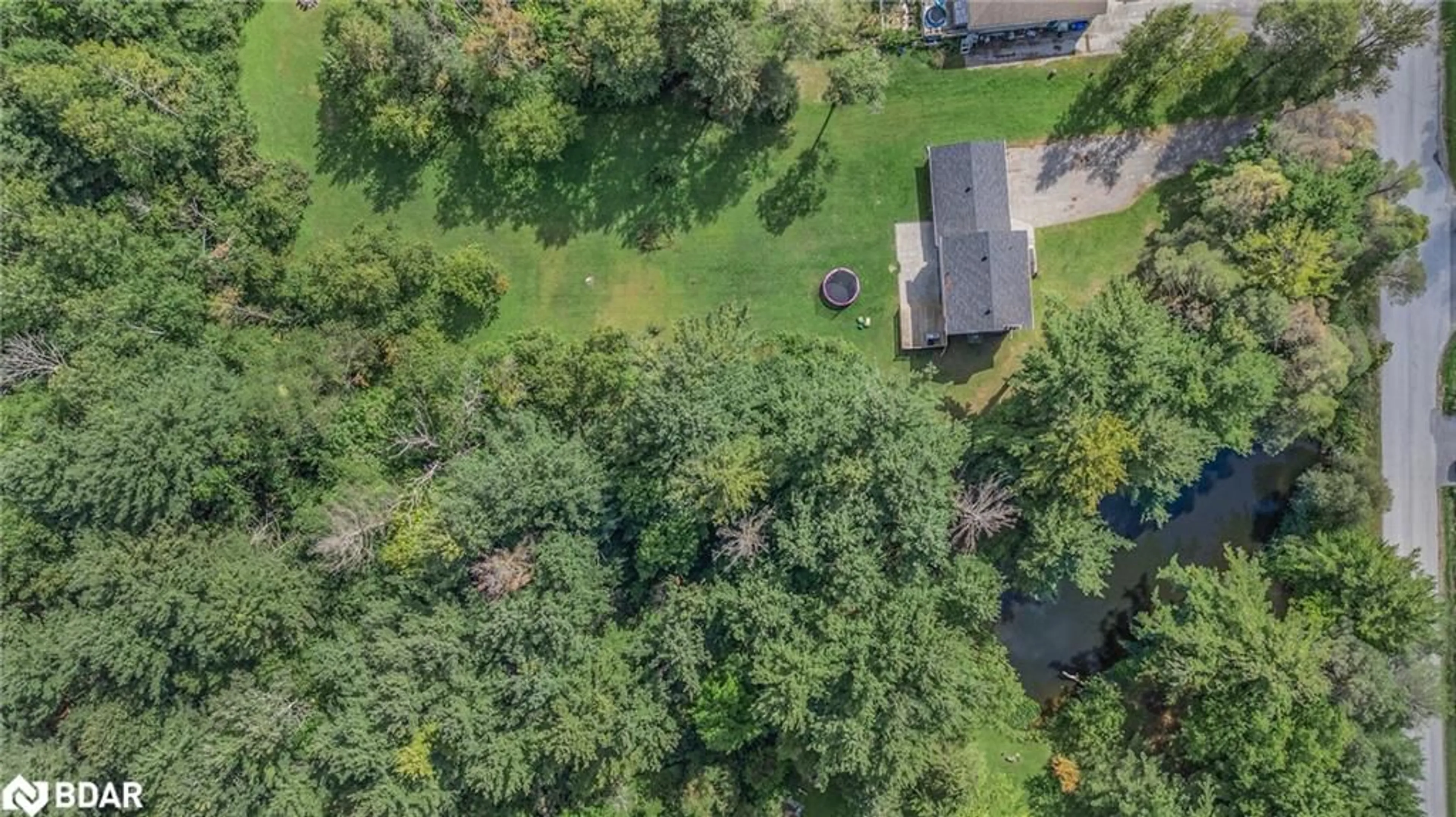 A pic from outside/outdoor area/front of a property/back of a property/a pic from drone, forest/trees view for 23 Lamers Rd, New Lowell Ontario L0M 1N0