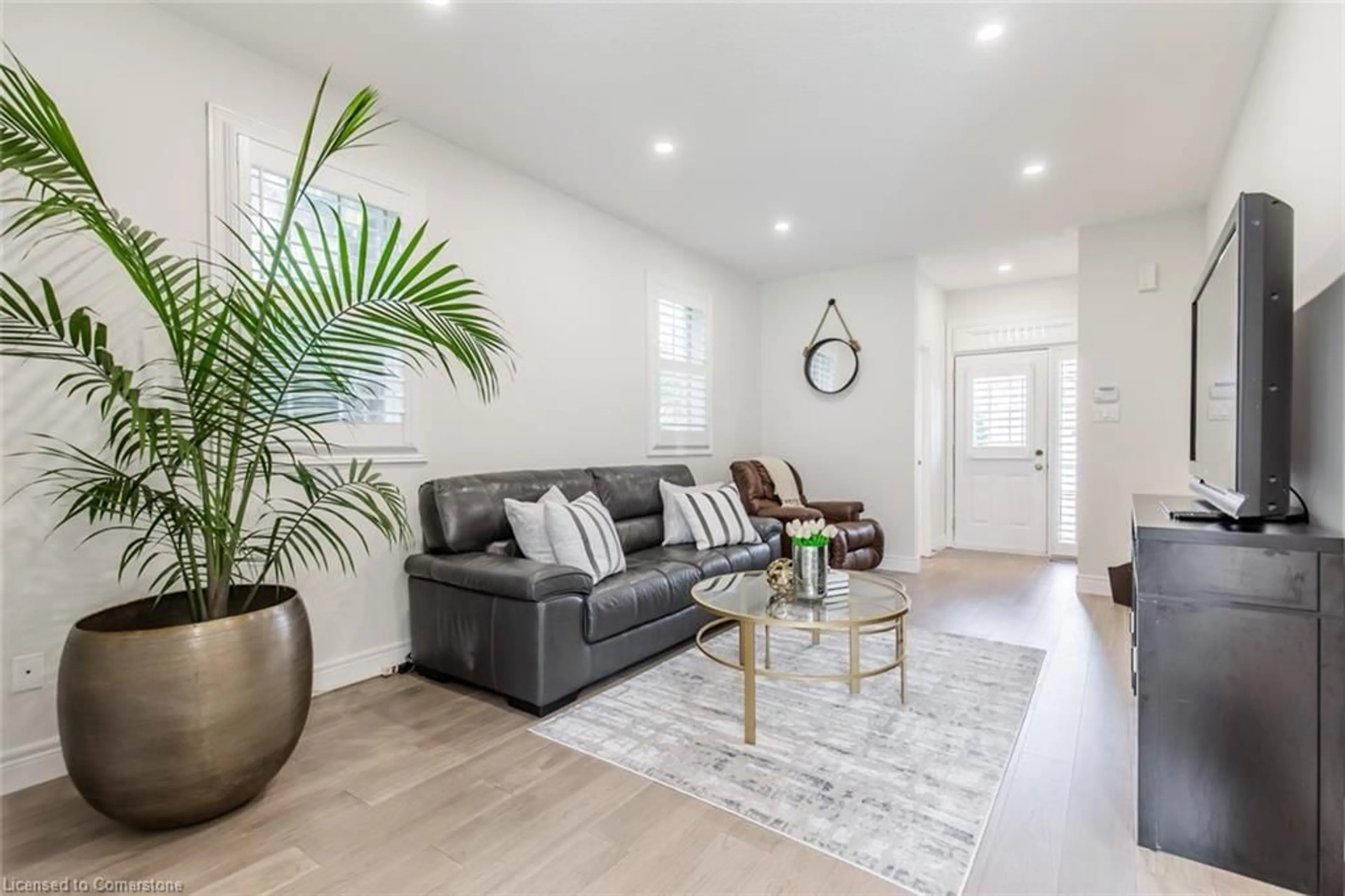 Living room with furniture, wood/laminate floor for 109 Peachwood Cres, Stoney Creek Ontario L8E 5Z7