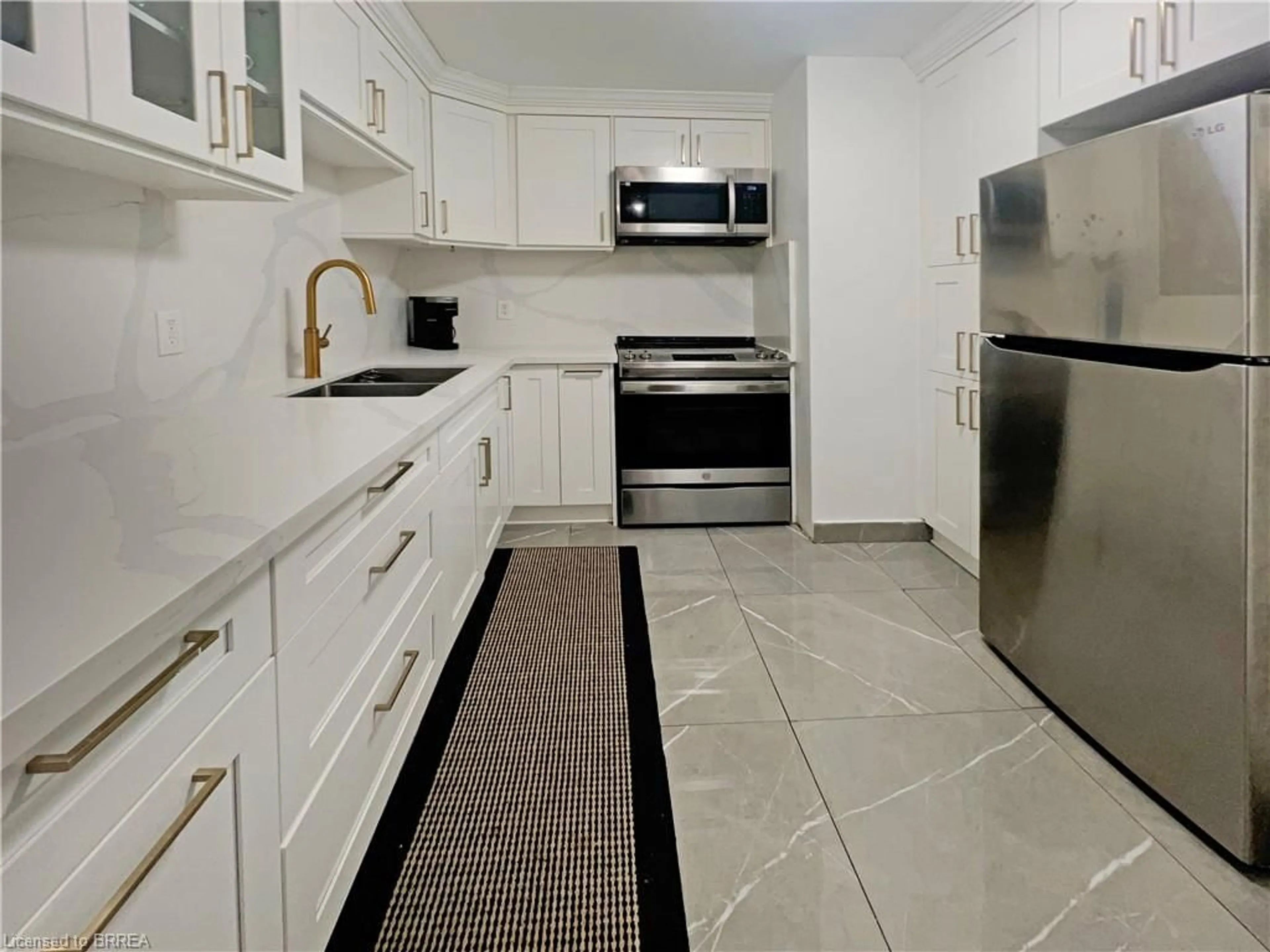 Standard kitchen, ceramic/tile floor for 2323 Confederation Pky #206, Mississauga Ontario L5B 1R6