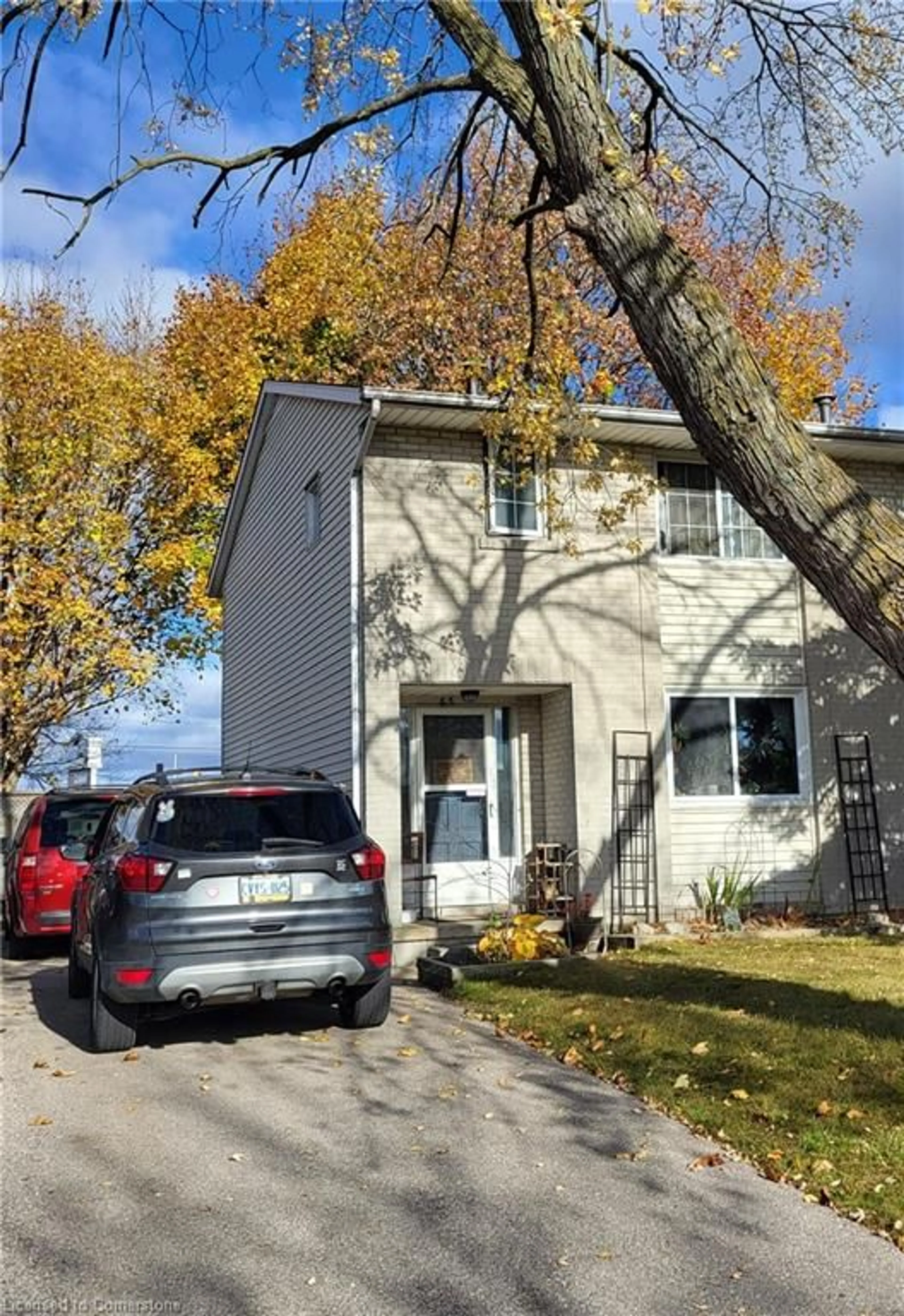 Home with vinyl exterior material, street for 65 Roberts Cres, Kitchener Ontario N2E 1A6