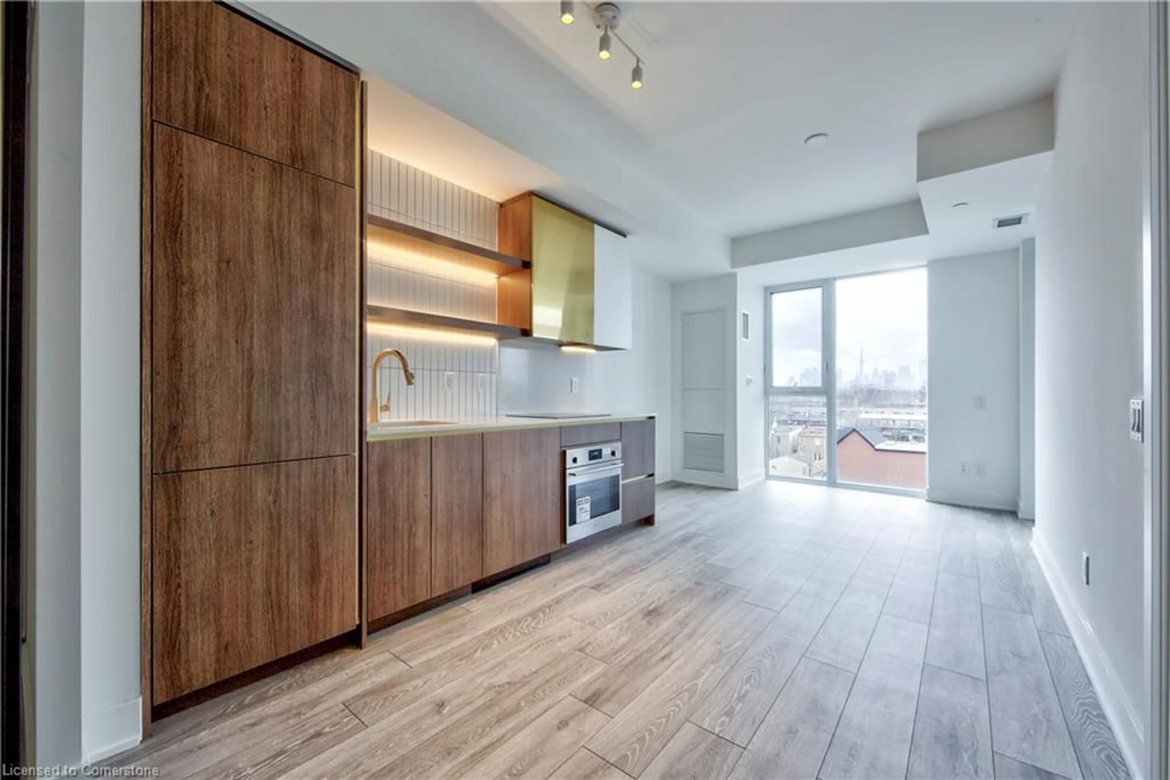 Open concept kitchen, wood/laminate floor for 1285 Queen St #514, Toronto Ontario M4L 1C2