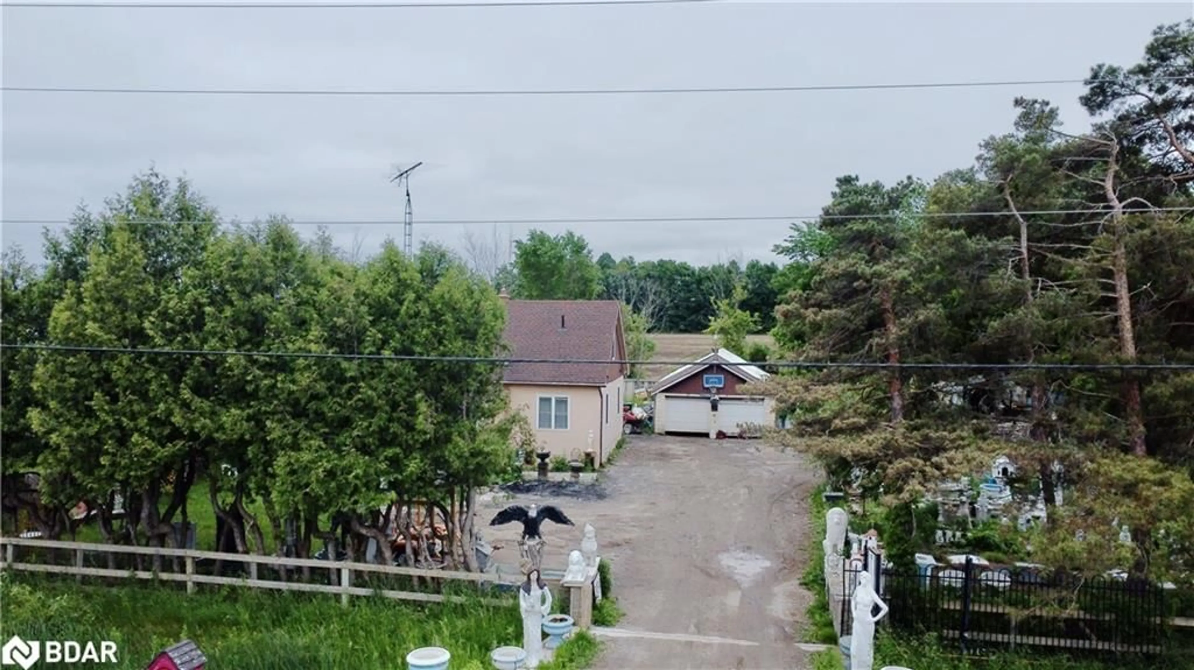 A pic from outside/outdoor area/front of a property/back of a property/a pic from drone, street for 1231 10th Line, Innisfil Ontario L9S 3N5