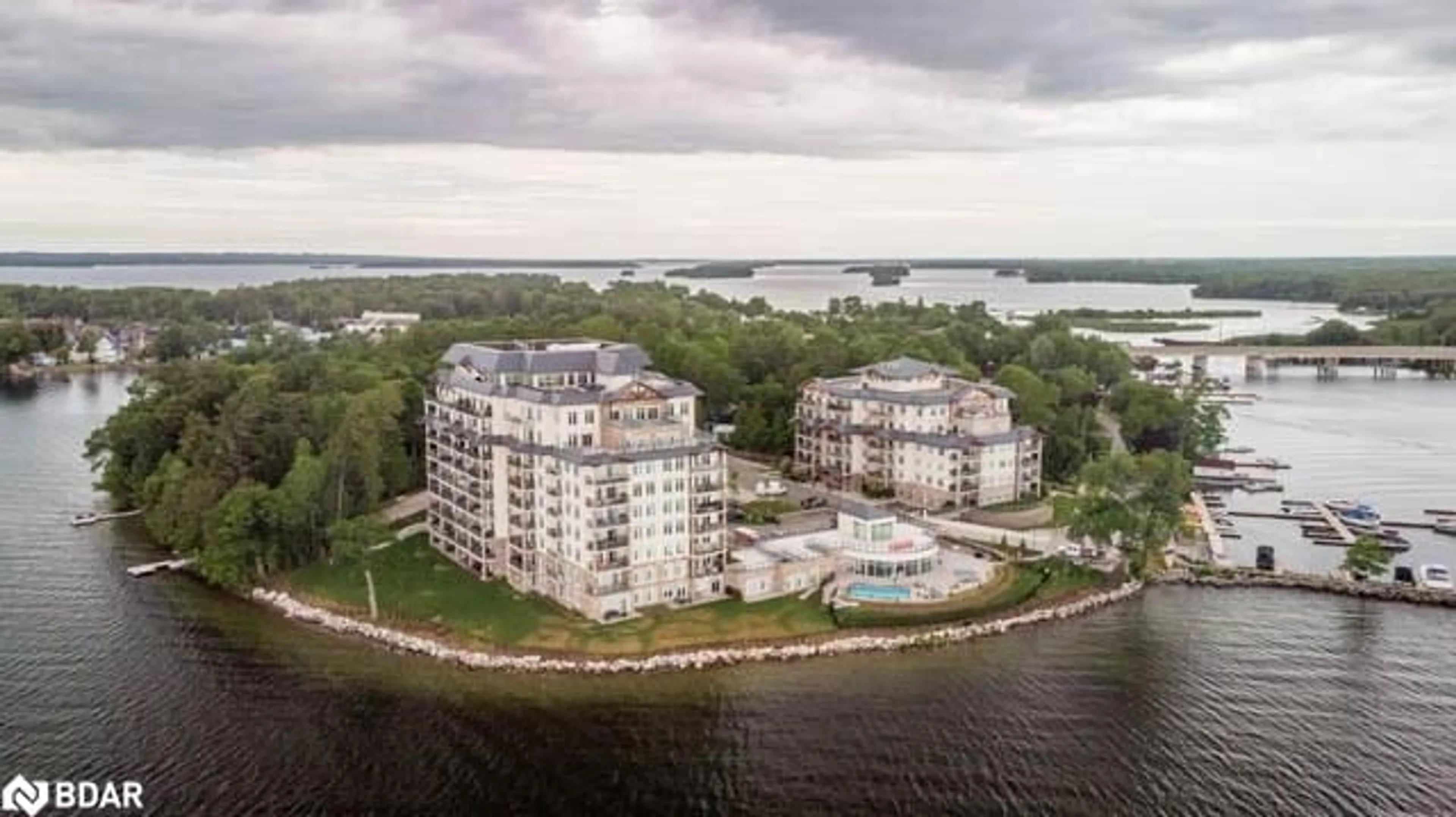 A pic from outside/outdoor area/front of a property/back of a property/a pic from drone, water/lake/river/ocean view for 90 Orchard Point Road #105, Orillia Ontario L3V 8K4