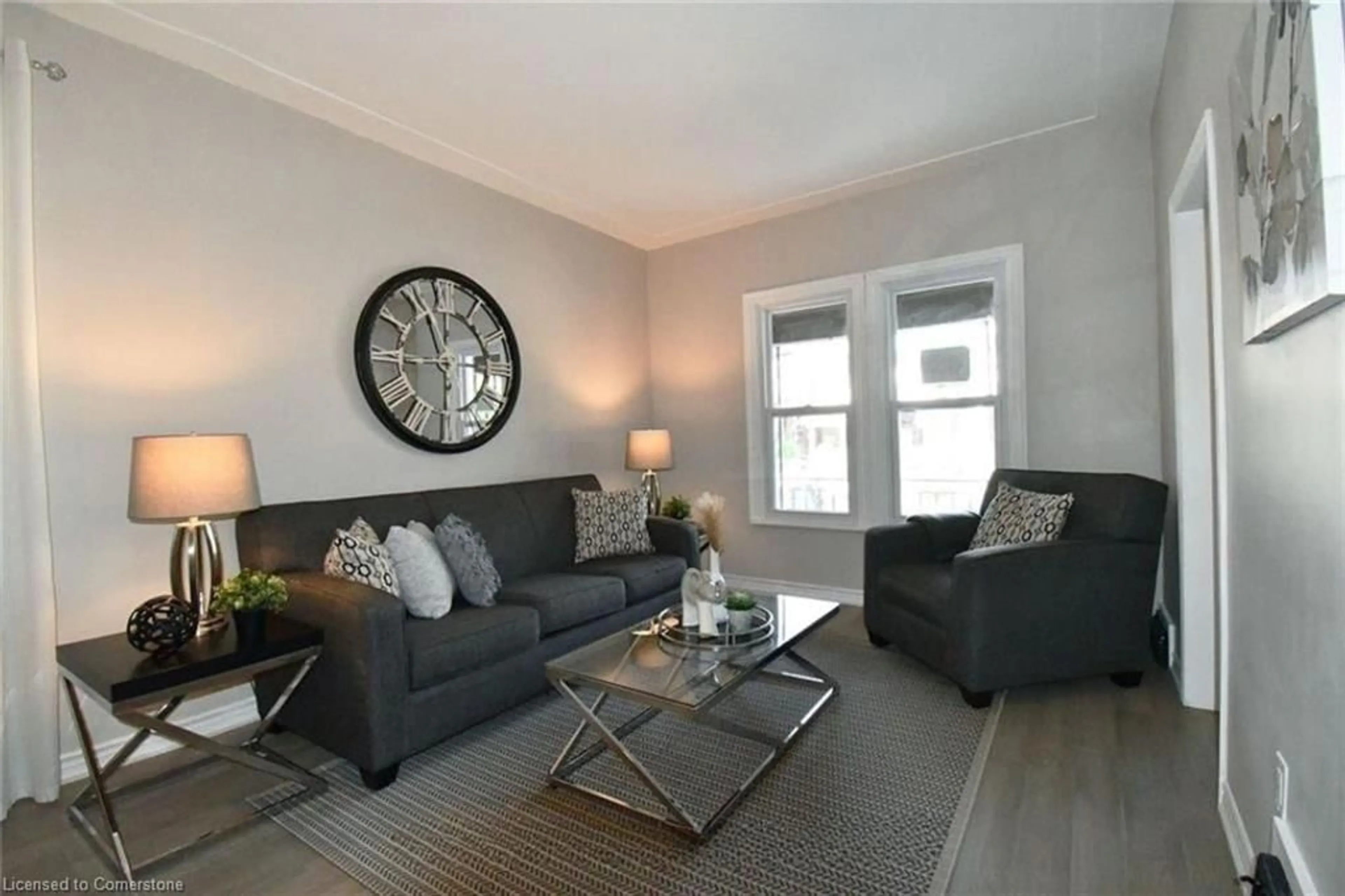 Living room with furniture, wood/laminate floor for 242 Balmoral Ave, Hamilton Ontario L8L 7S2