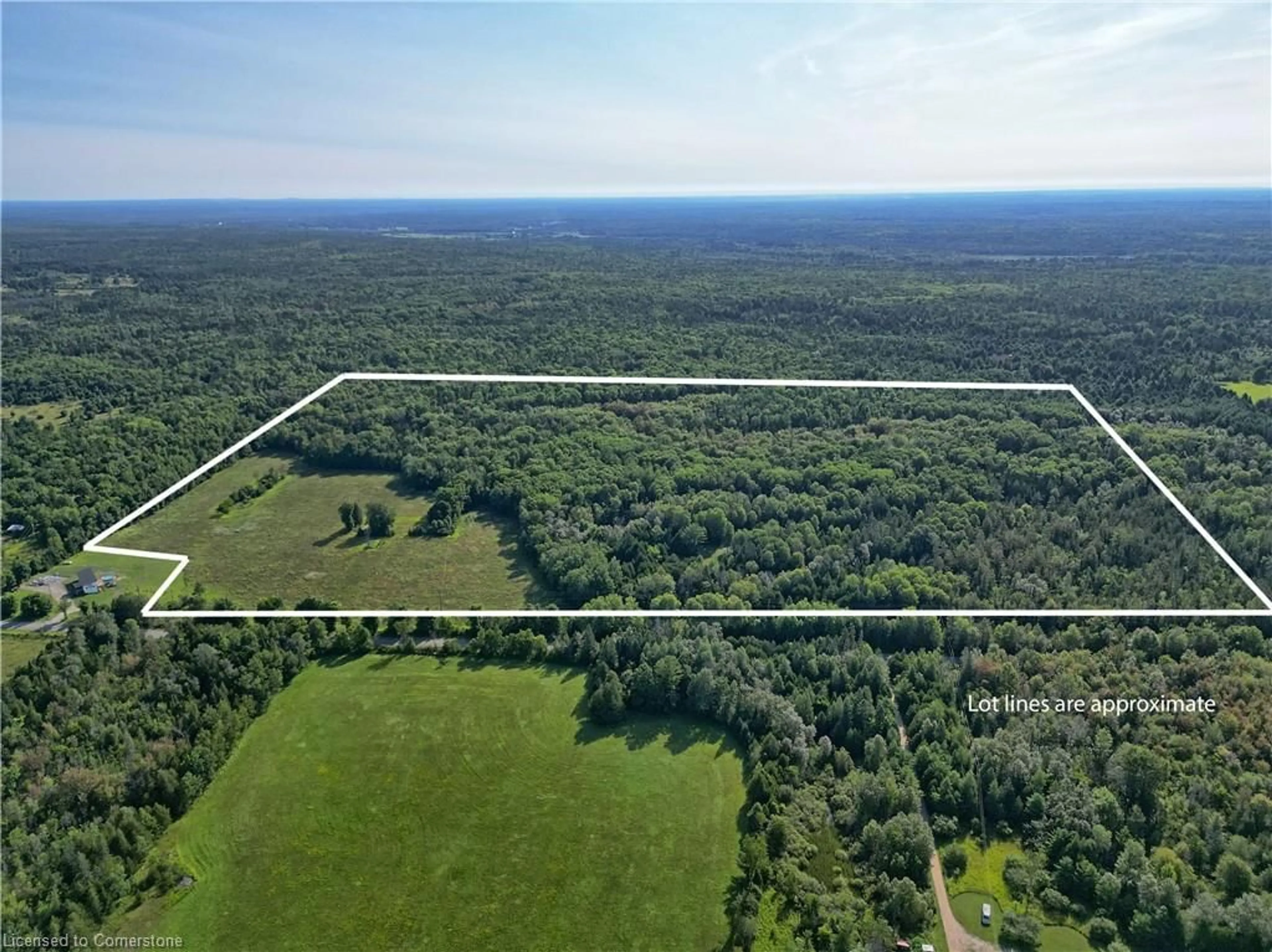 A pic from outside/outdoor area/front of a property/back of a property/a pic from drone, forest/trees view for 1058 Northline Rd, Kawartha Lakes Ontario K0M 1K0