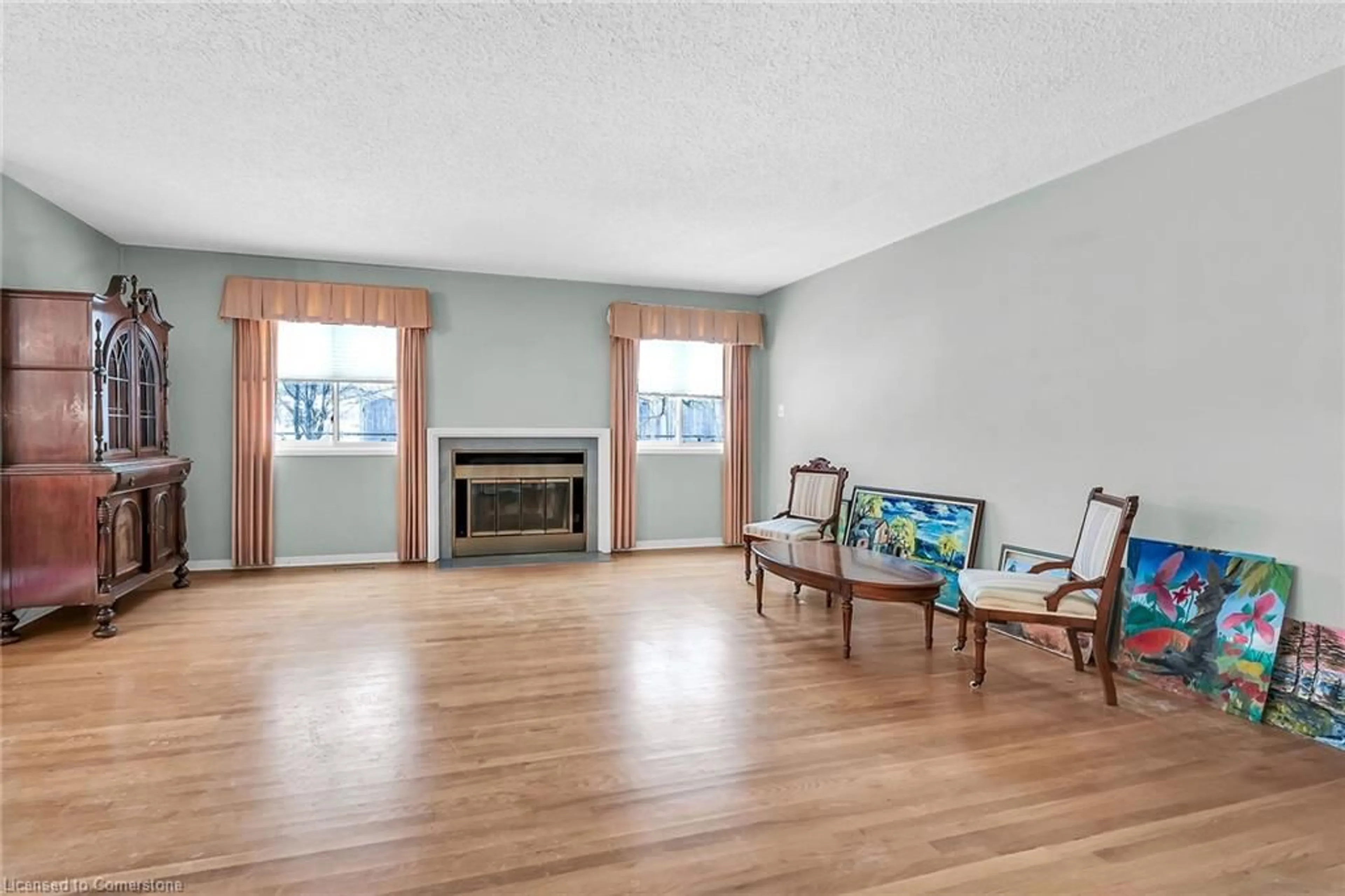 Living room with furniture, wood/laminate floor for 38 Elora Dr #37, Hamilton Ontario L9C 7L5