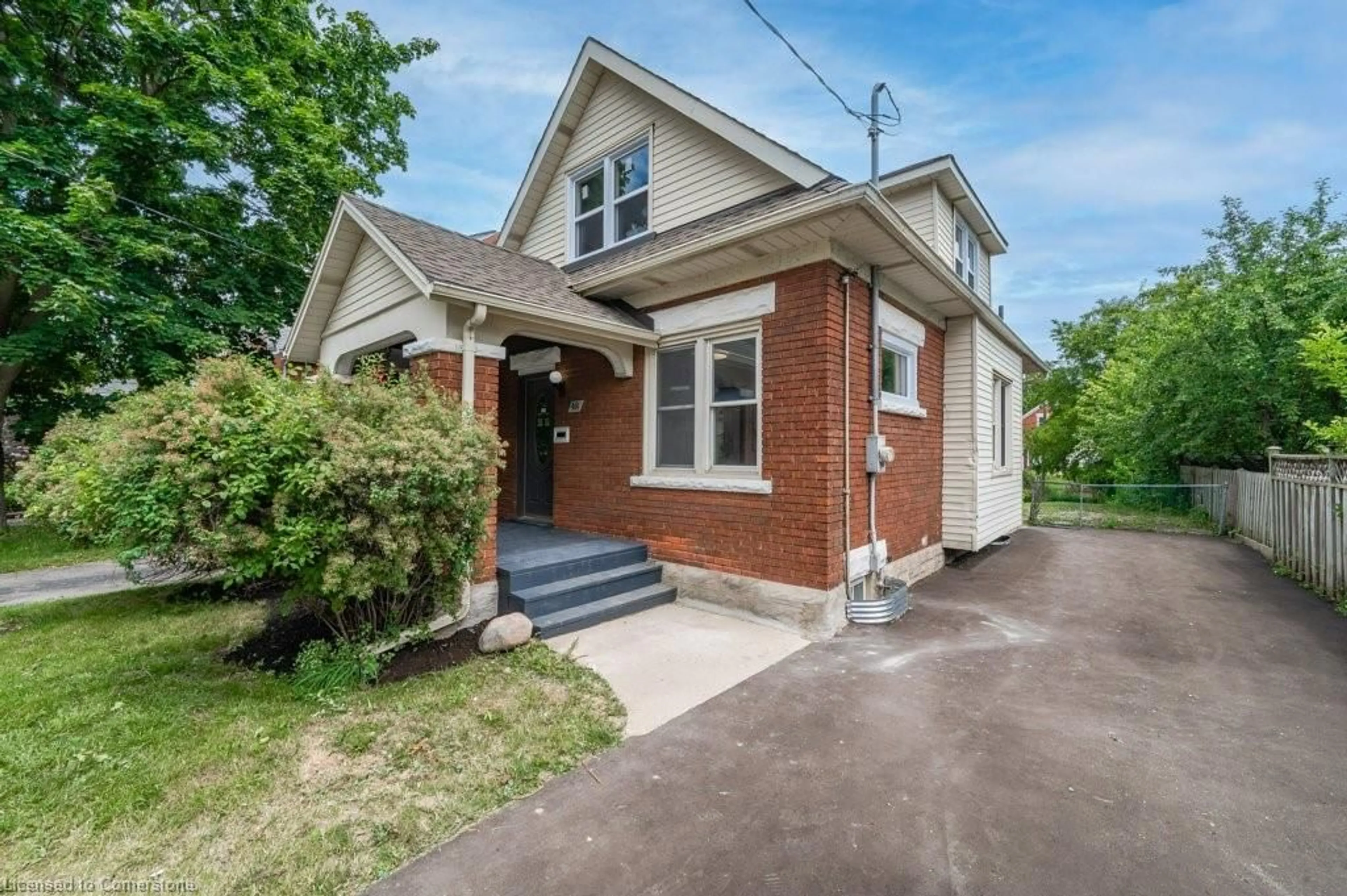 Home with brick exterior material, street for 48 Troy St, Kitchener Ontario N2H 1L8