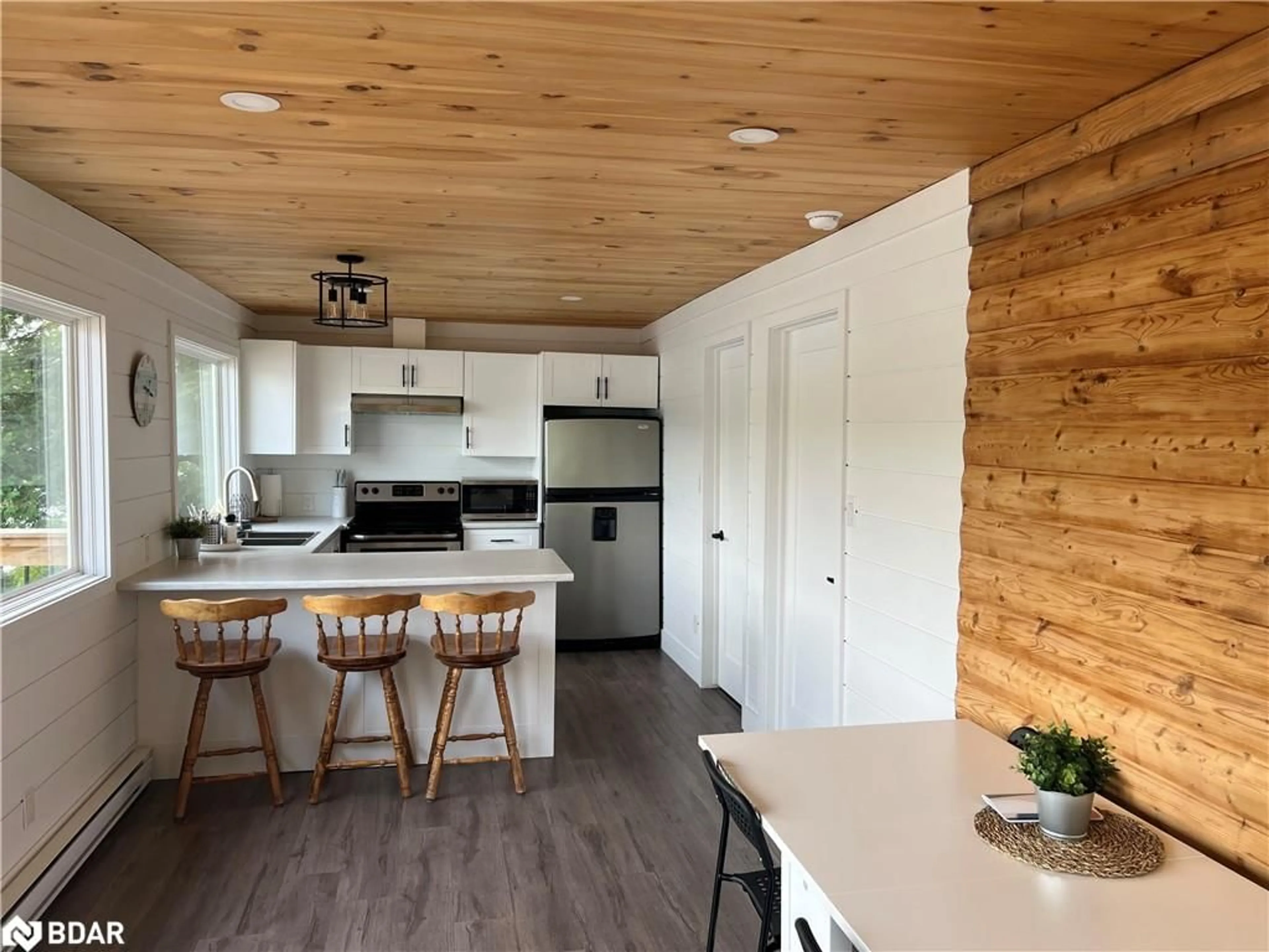 Open concept kitchen, wood/laminate floor for 203 Healey Lake Water Rd, ARCHIPELAGO Ontario P0C 1H0