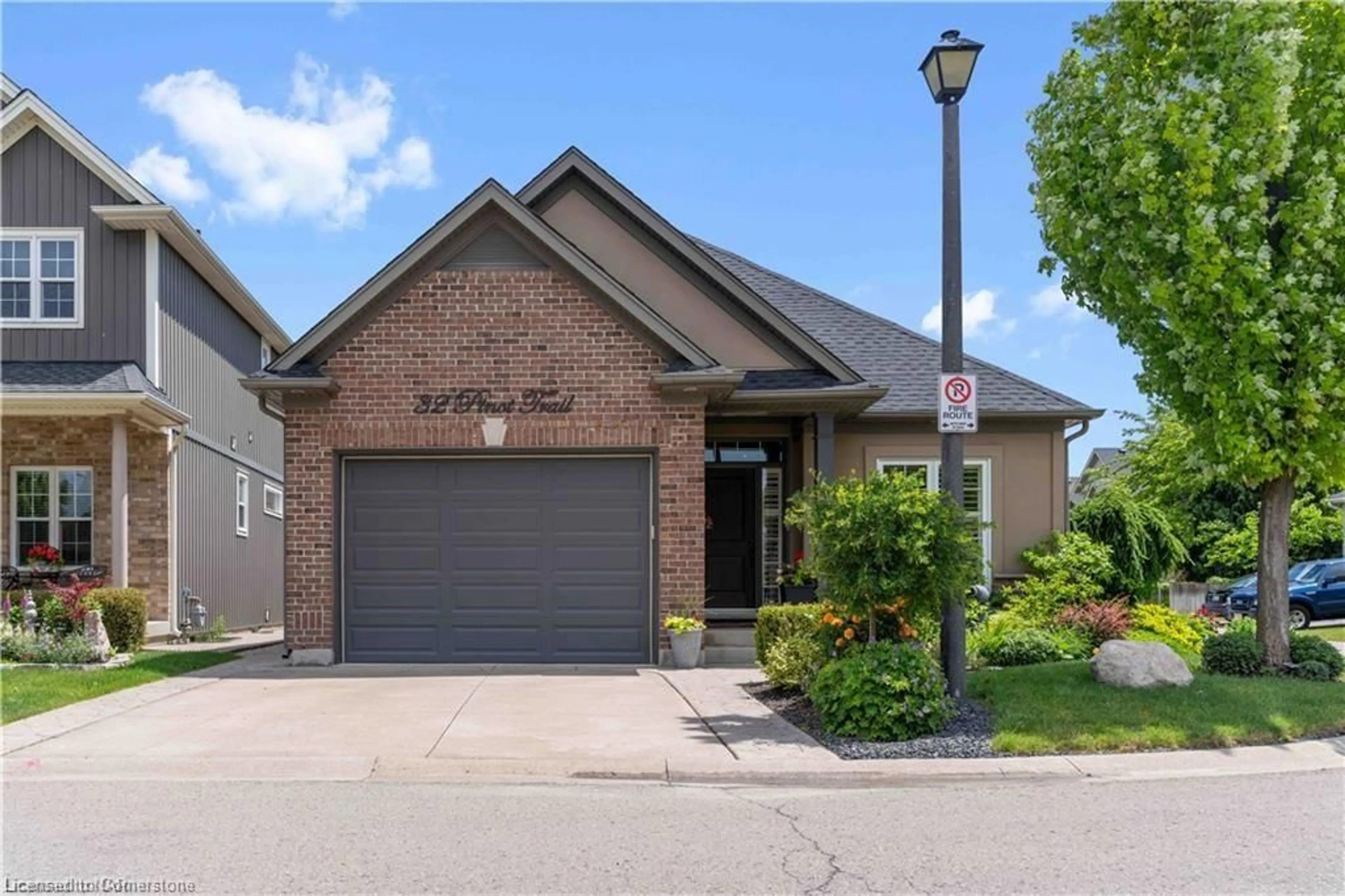 Home with brick exterior material, street for 32 Pinot Trail, Niagara-on-the-Lake Ontario L0S 1T0