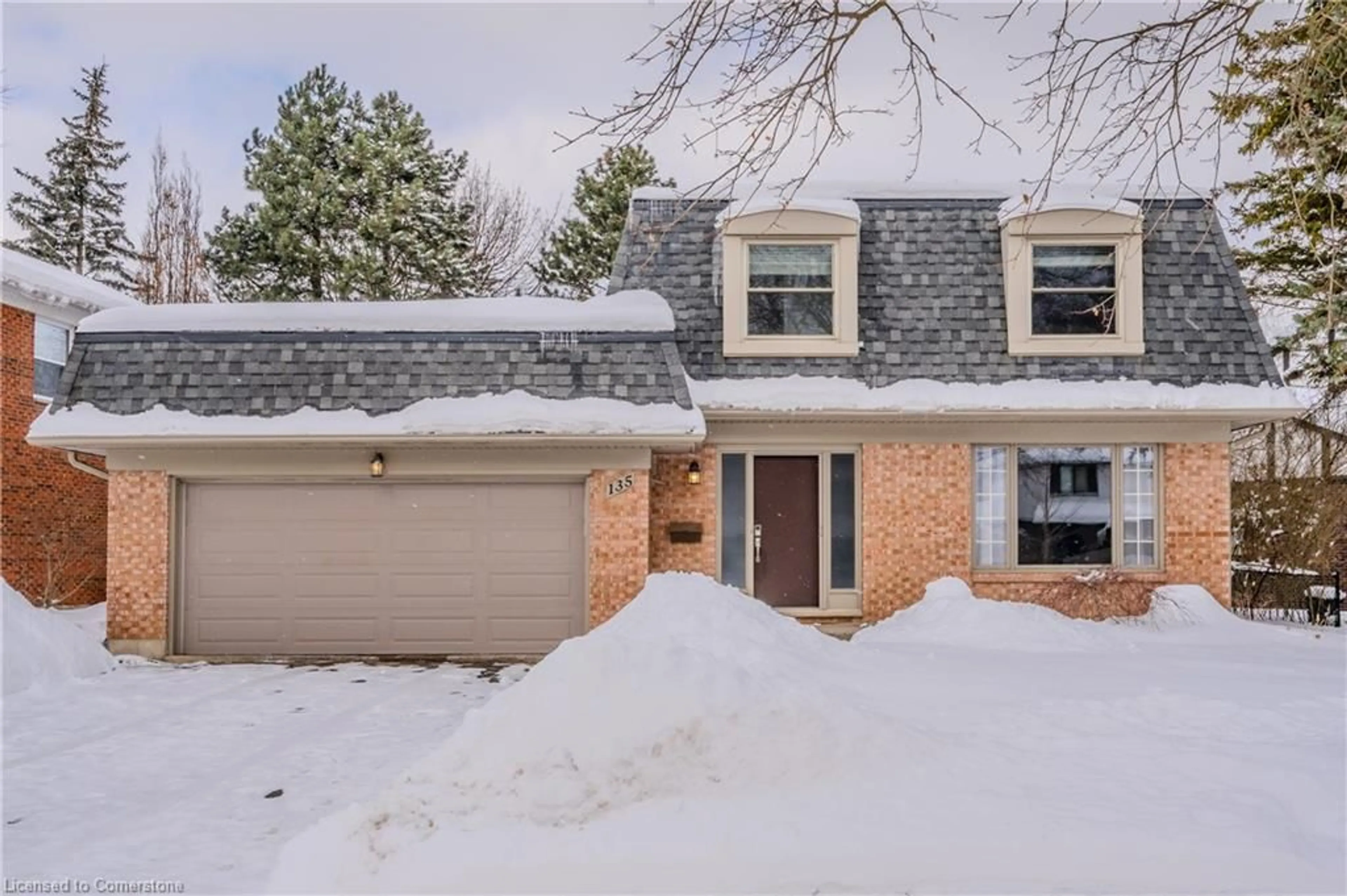 Home with brick exterior material, street for 135 Briarcliffe Cres, Waterloo Ontario N2L 5T6