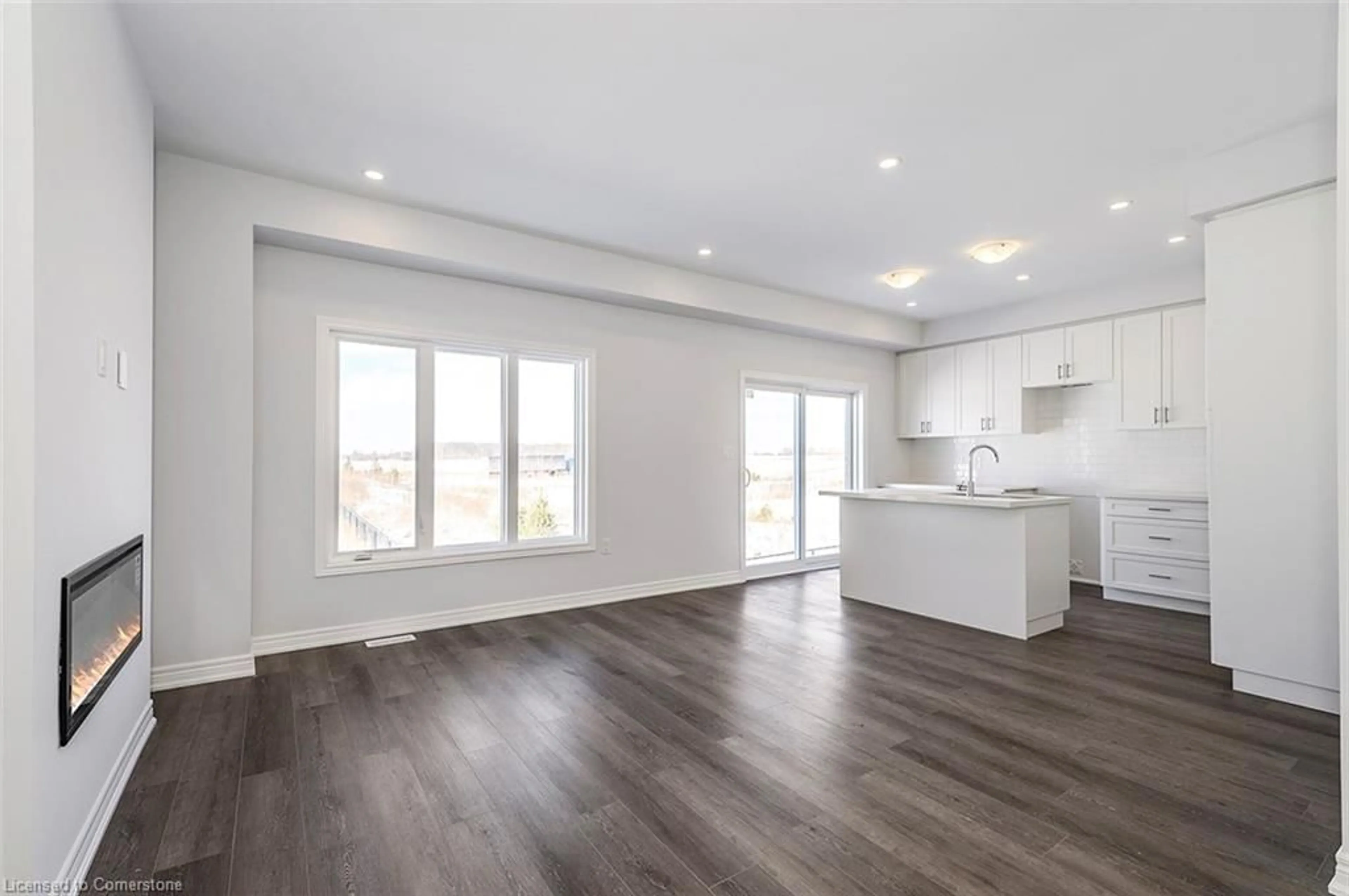 Open concept kitchen, wood/laminate floor for 205 Thames Way #44, Hamilton Ontario L0R 1W0