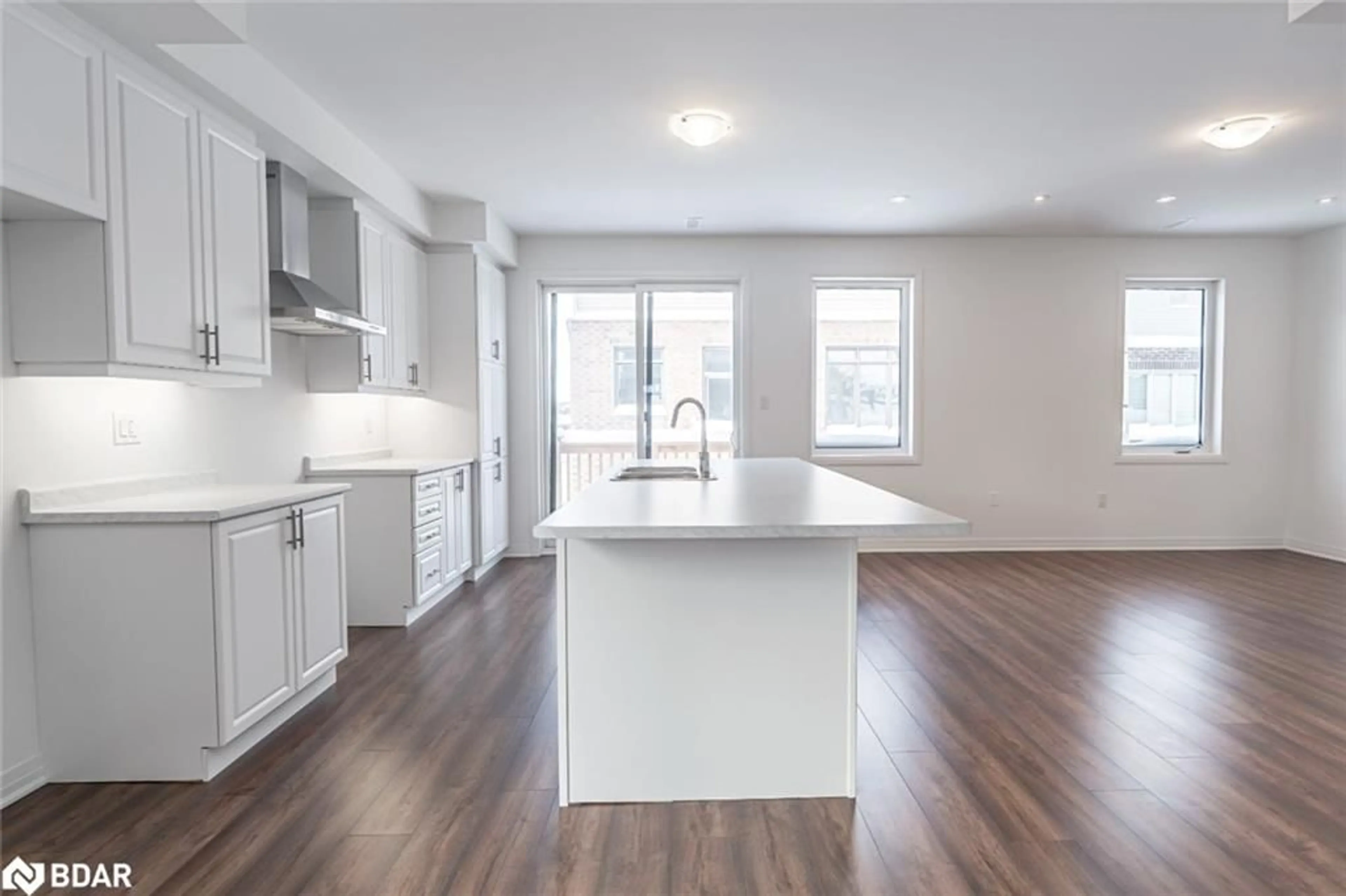 Open concept kitchen, wood/laminate floor for 112 West Oak Trail, Barrie Ontario L9J 0L1