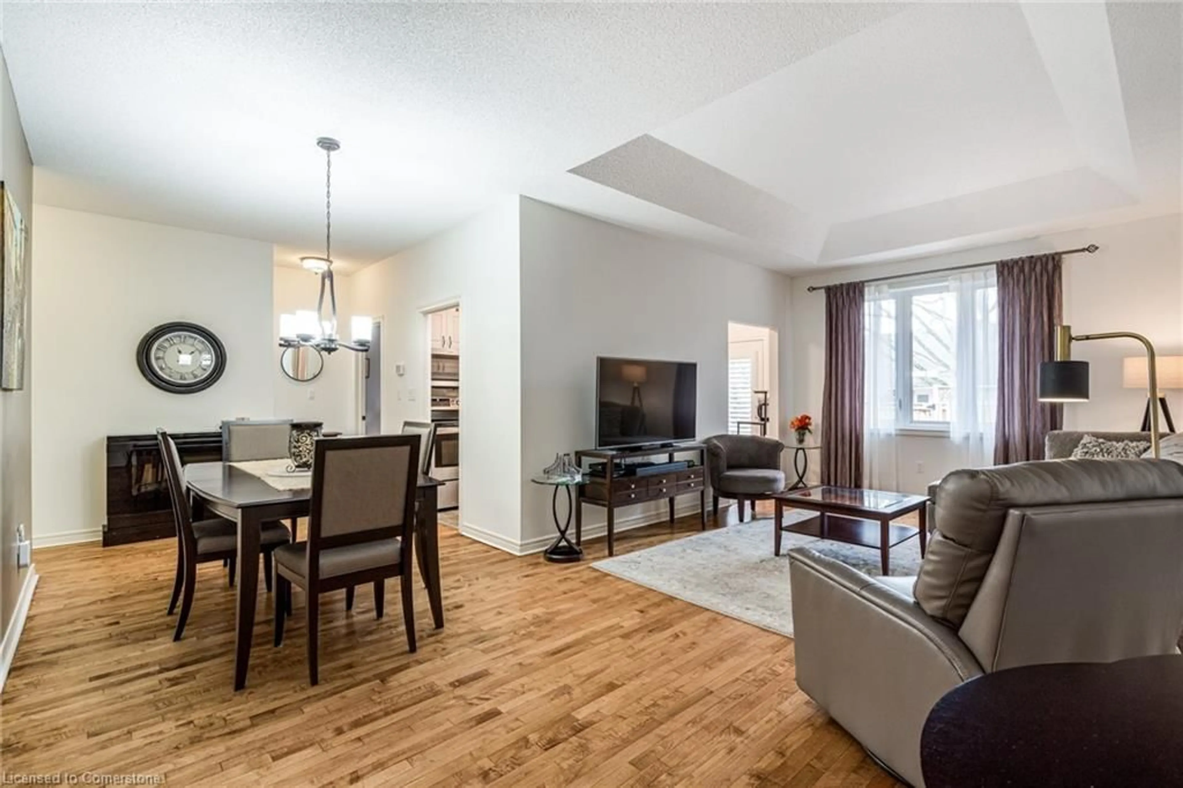 Living room with furniture, wood/laminate floor for 97 Sandollar Dr, Mount Hope Ontario L0R 1W0