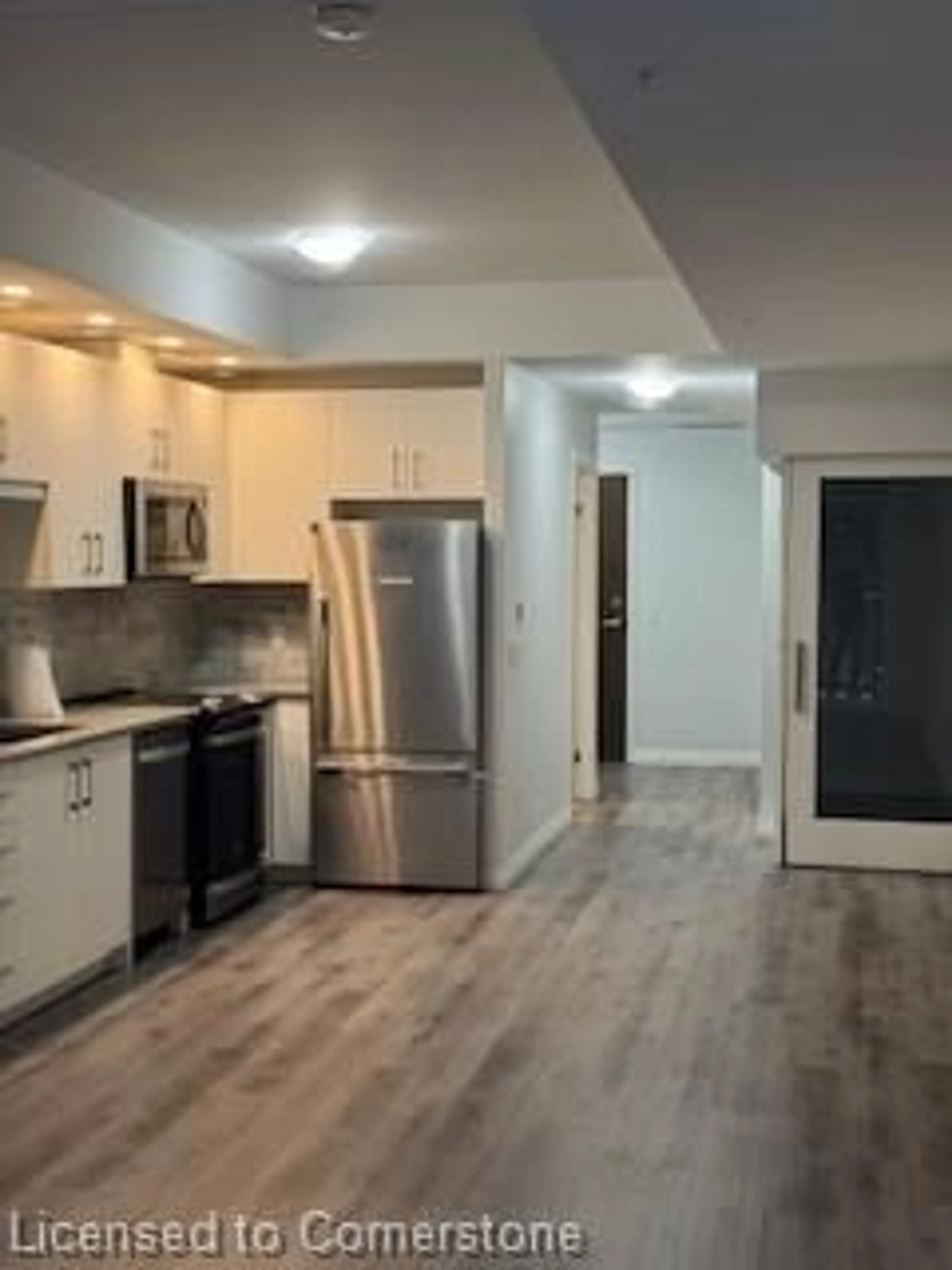 Open concept kitchen, wood/laminate floor for 108 Garment St #203, Kitchener Ontario N2G 2B3