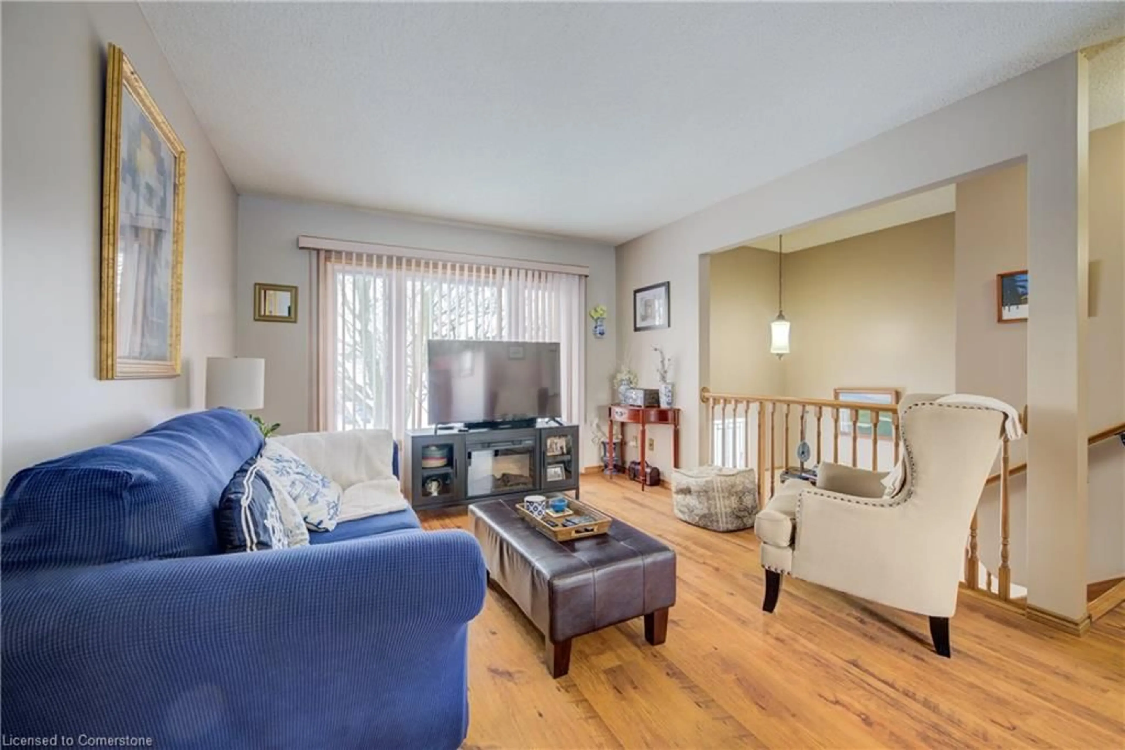 Living room with furniture, wood/laminate floor for 20 Settlers Dr, Kitchener Ontario N2E 2L3