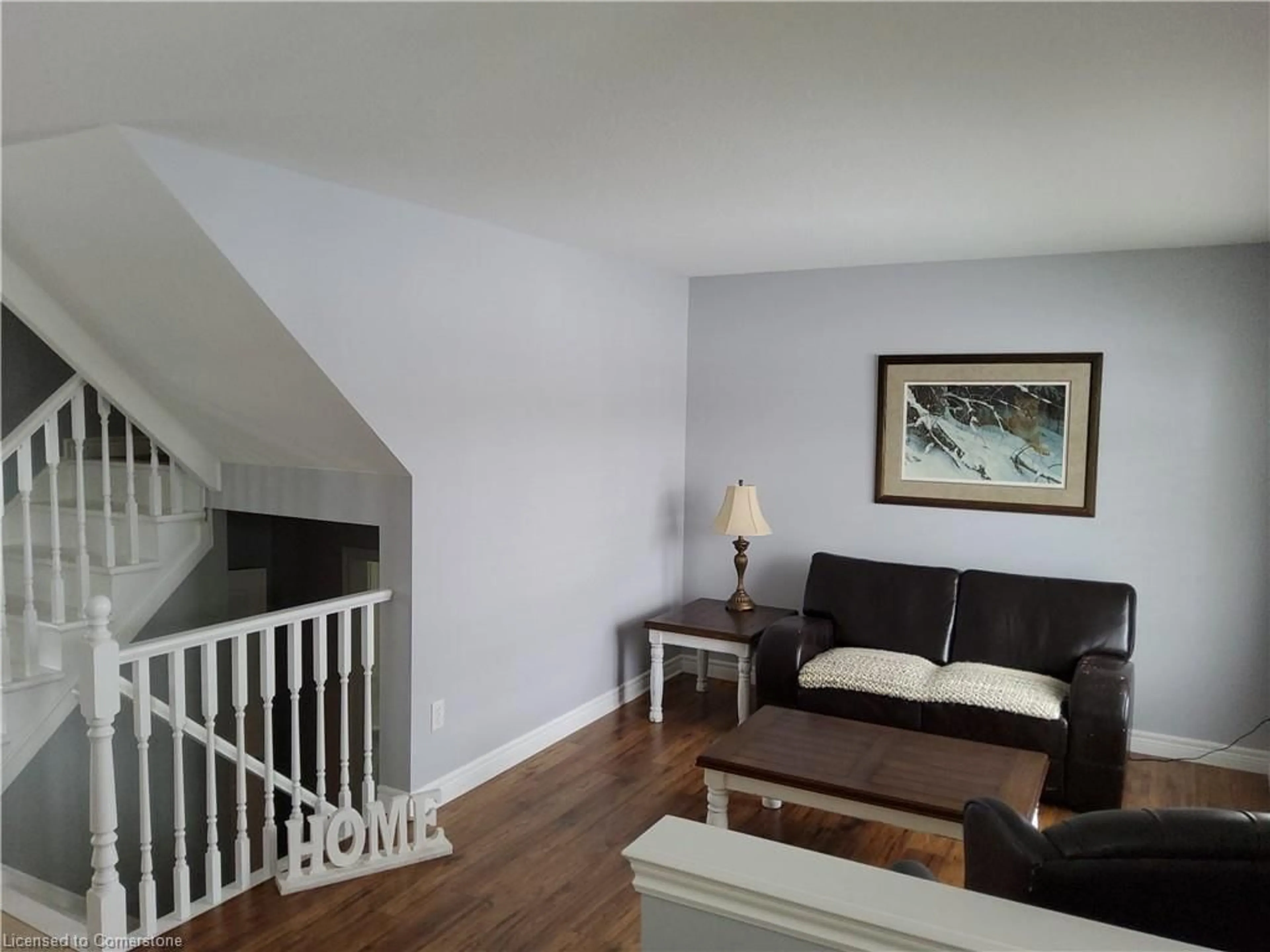 Living room with furniture, wood/laminate floor for 18 Rideau Cres, Hamilton Ontario L8T 2S9