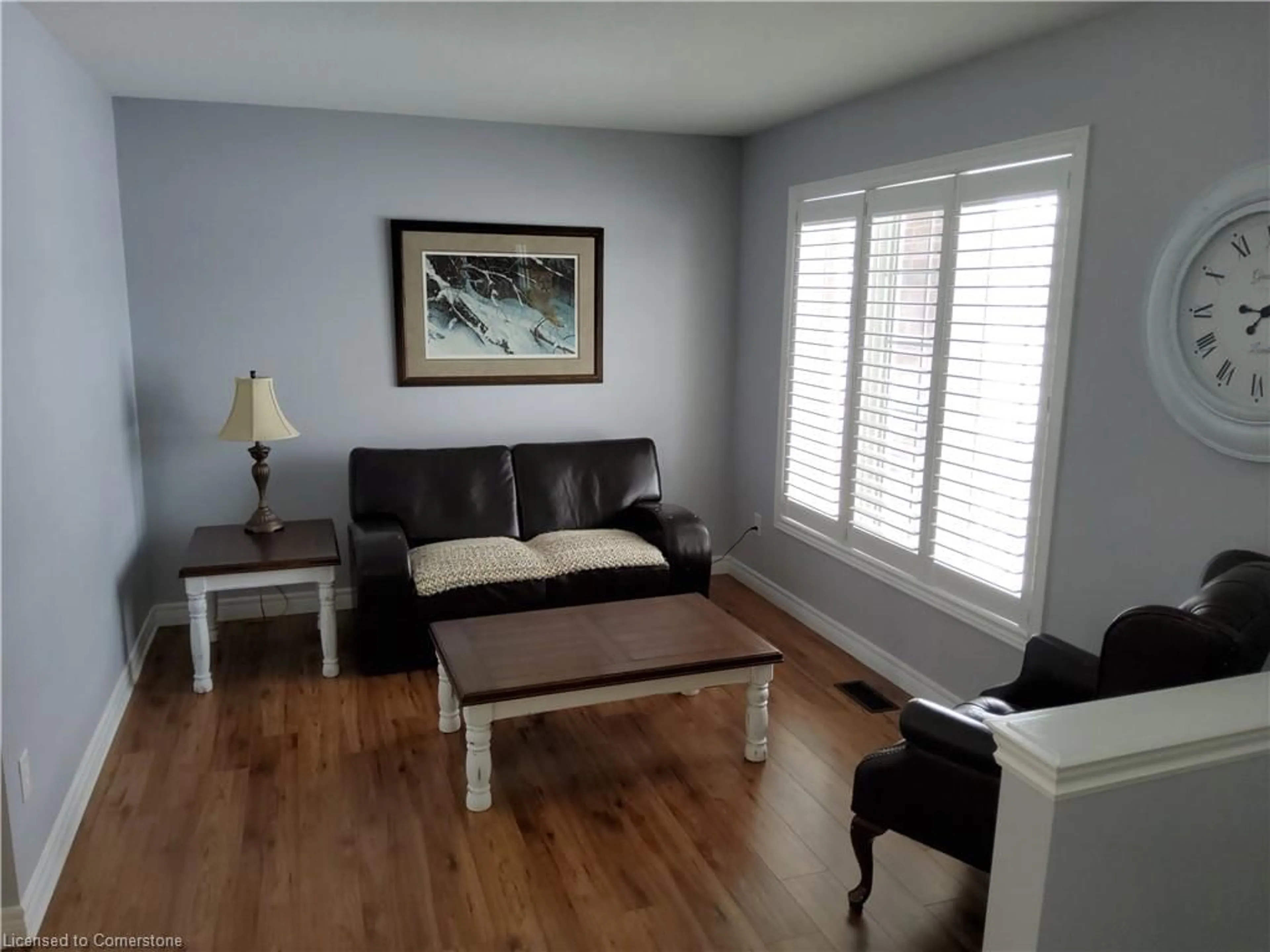 Living room with furniture, wood/laminate floor for 18 Rideau Cres, Hamilton Ontario L8T 2S9