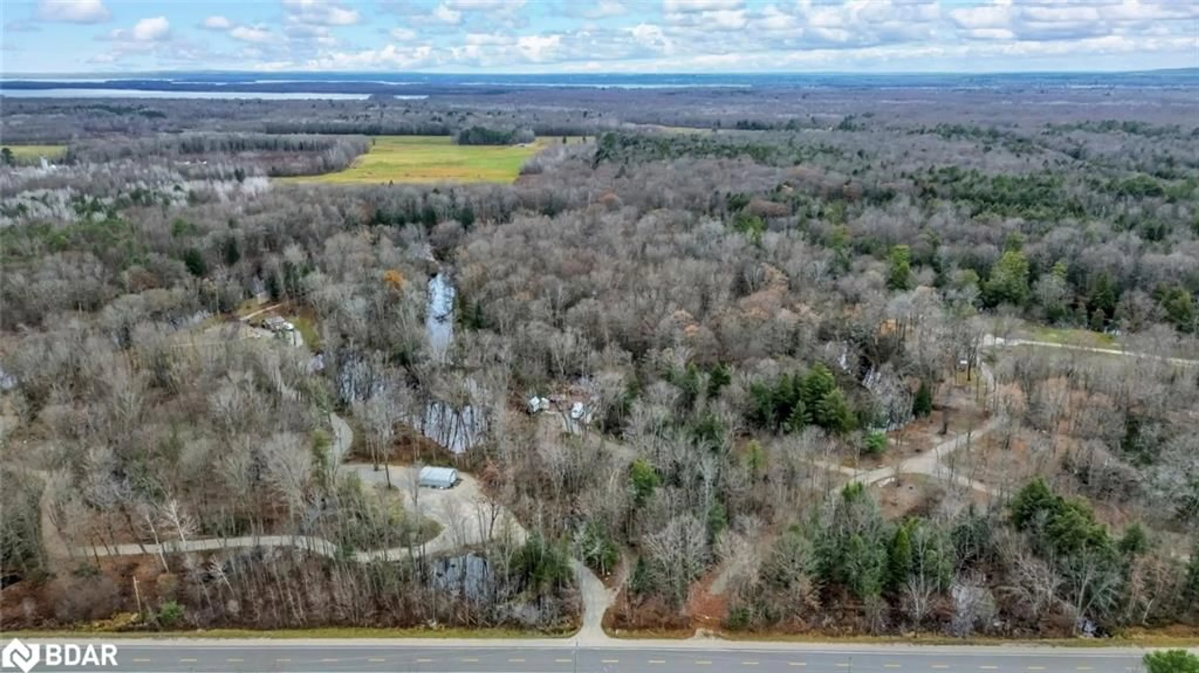 A pic from outside/outdoor area/front of a property/back of a property/a pic from drone, water/lake/river/ocean view for 7012 County Road 169, Washago Ontario L0K 2B0