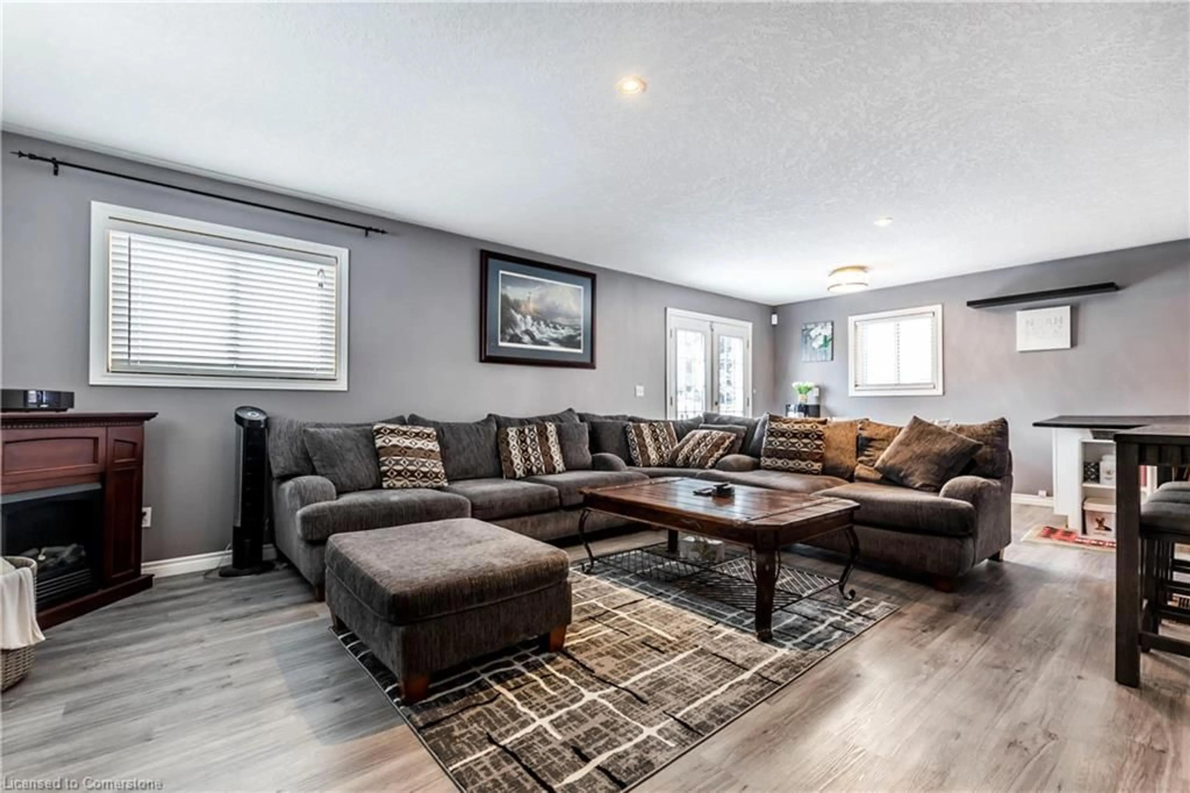 Living room with furniture, wood/laminate floor for 75 Sekura Cres, Cambridge Ontario N1R 7C9