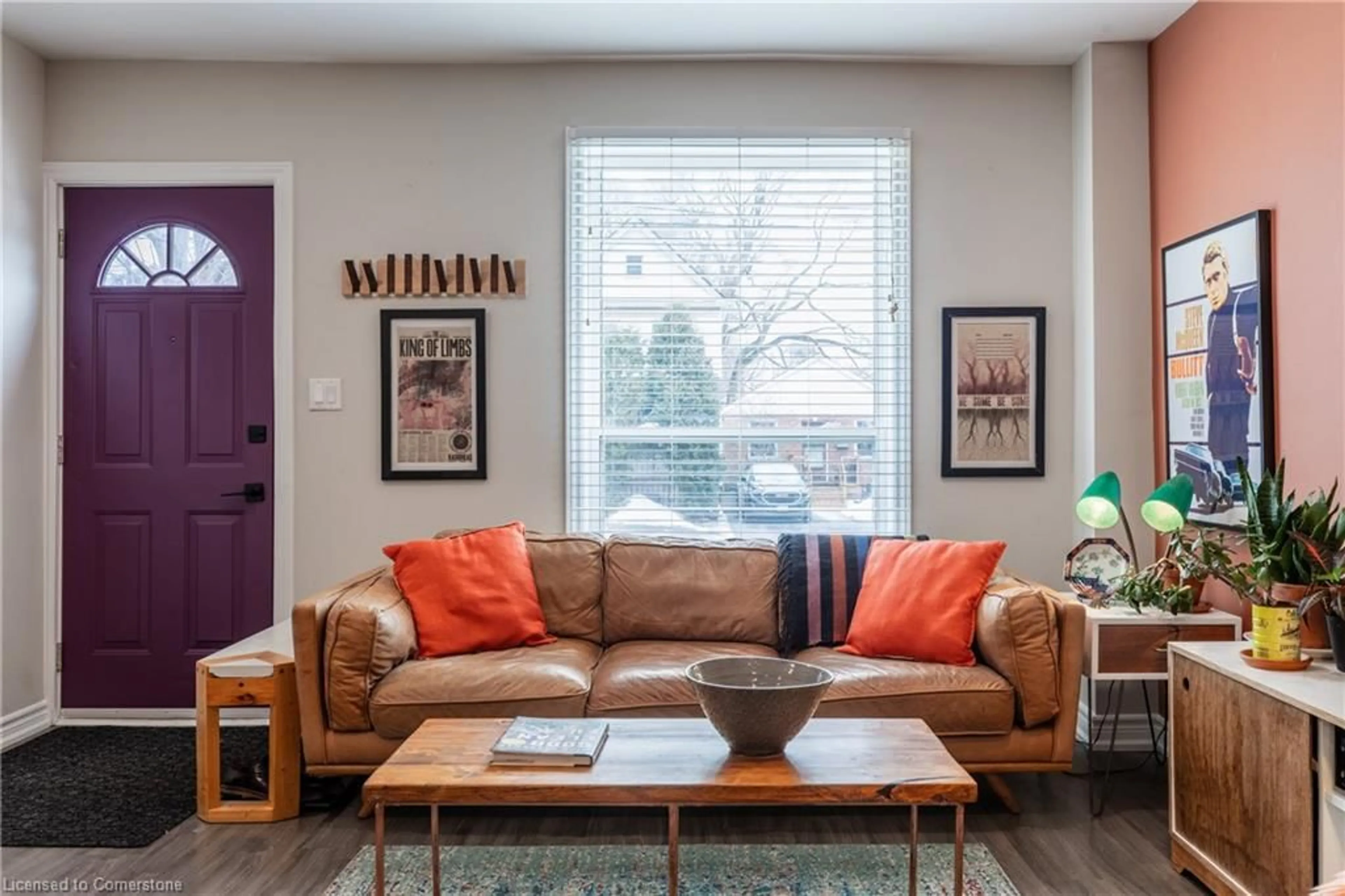 Living room with furniture, wood/laminate floor for 209 Macaulay St, Hamilton Ontario L8L 3X7