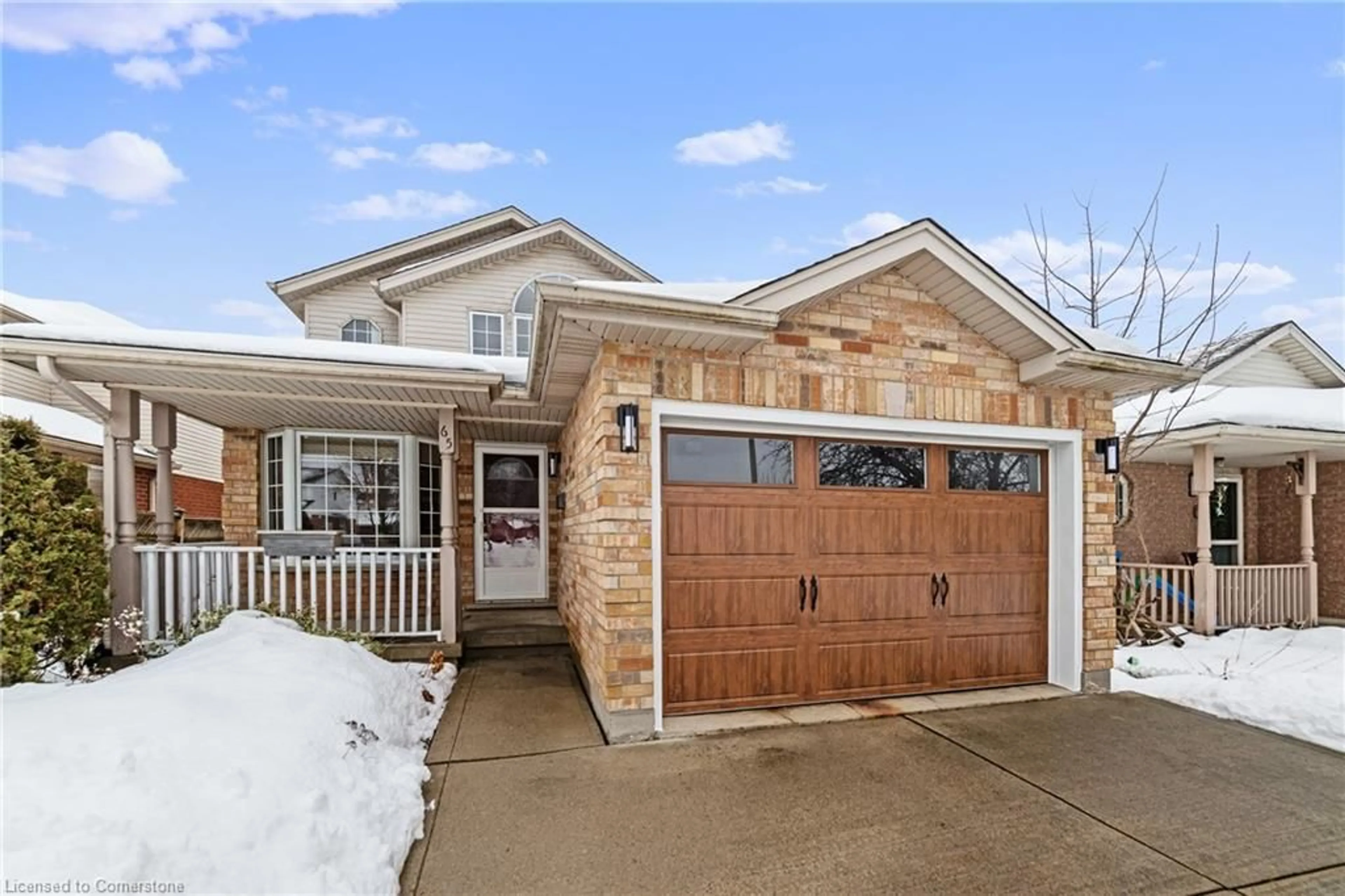 Home with brick exterior material, street for 65 Candlewood Dr, Guelph Ontario N1K 1T6