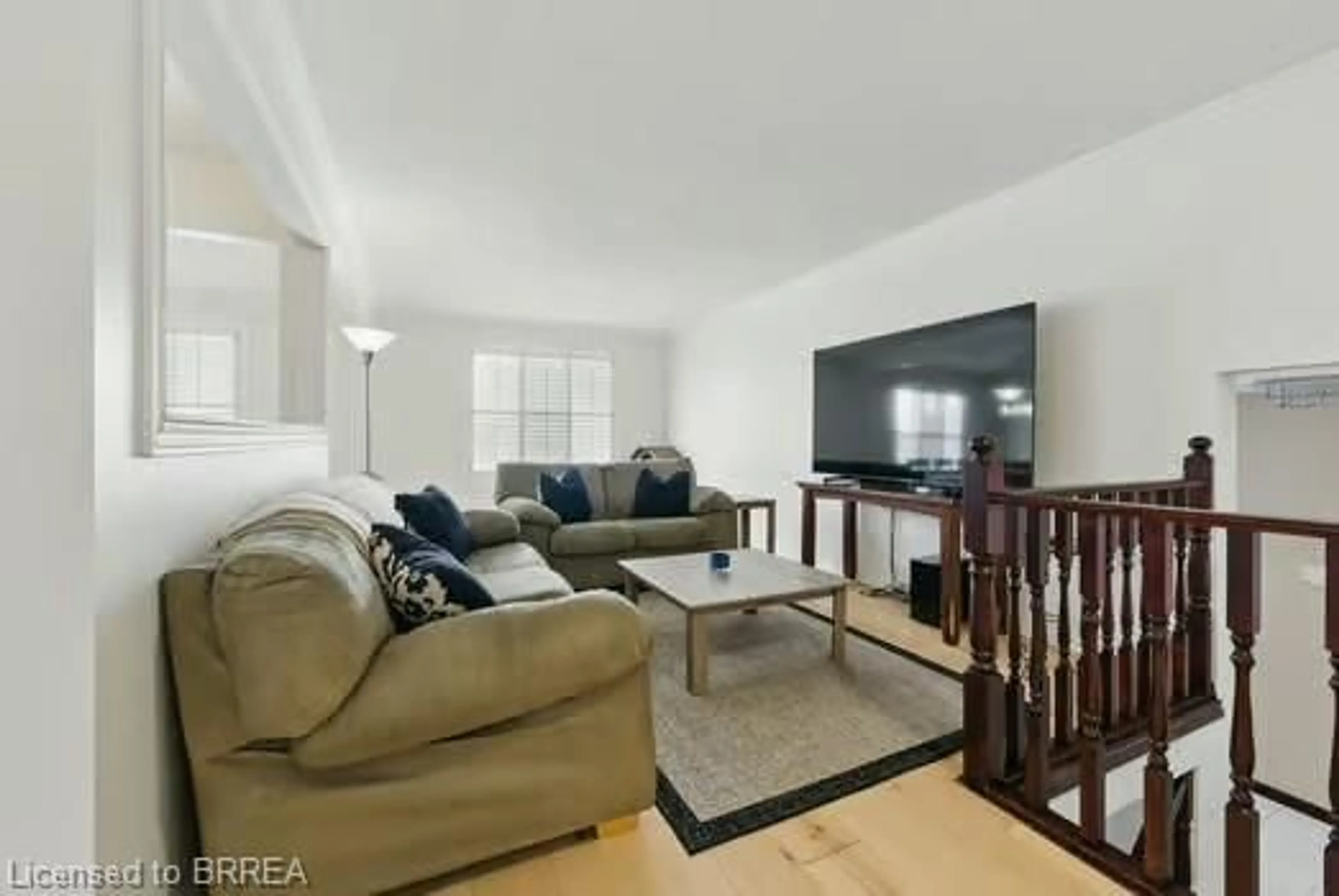 Living room with furniture, wood/laminate floor for 44 Windsor Dr, St. George Ontario N0E 1N0