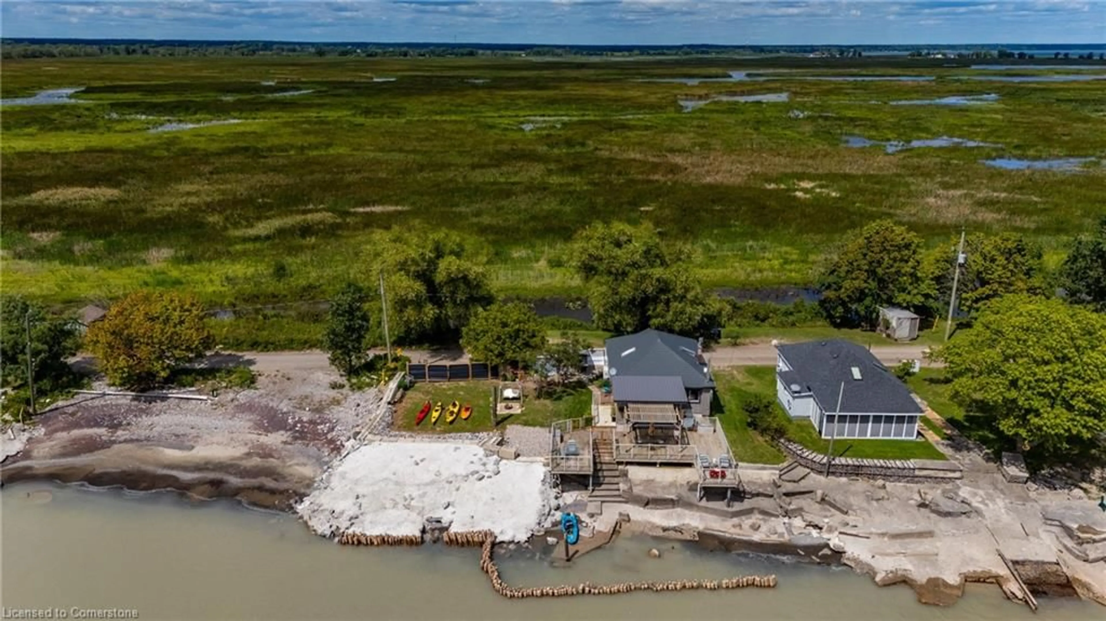 A pic from outside/outdoor area/front of a property/back of a property/a pic from drone, water/lake/river/ocean view for 221-223 Hastings Dr, Port Rowan Ontario N0E 1M0