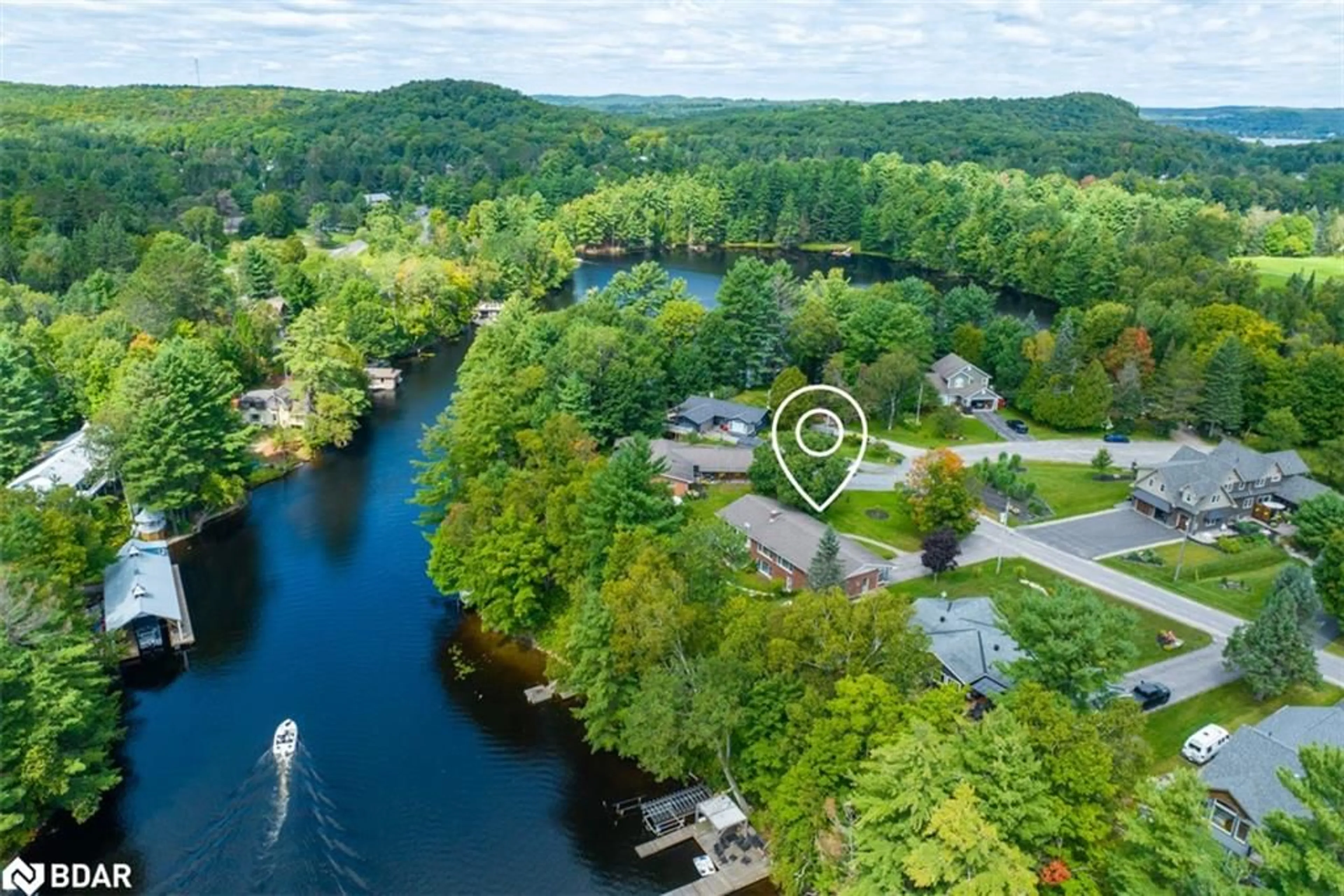 A pic from outside/outdoor area/front of a property/back of a property/a pic from drone, water/lake/river/ocean view for 443 By-Lock Acres Rd, Huntsville Ontario P1H 1S1
