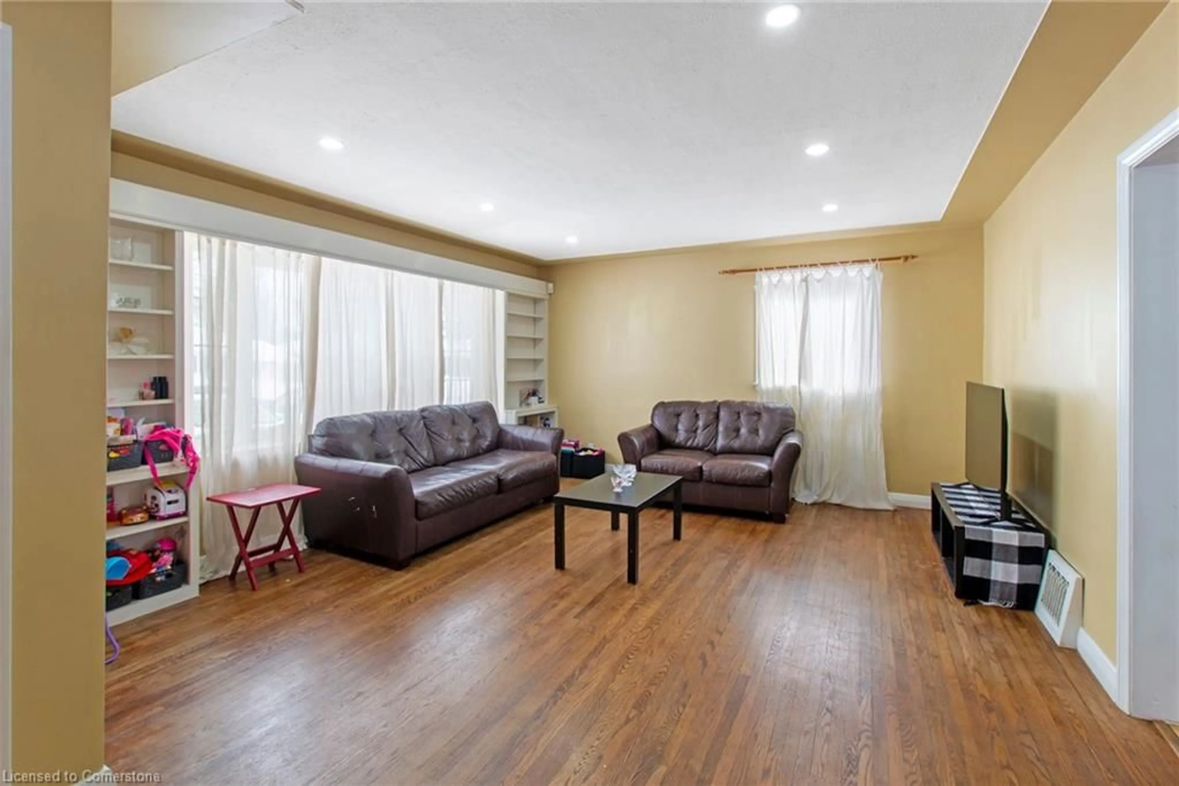 Living room with furniture, wood/laminate floor for 357 Regal Dr, London Ontario N5Y 1J5