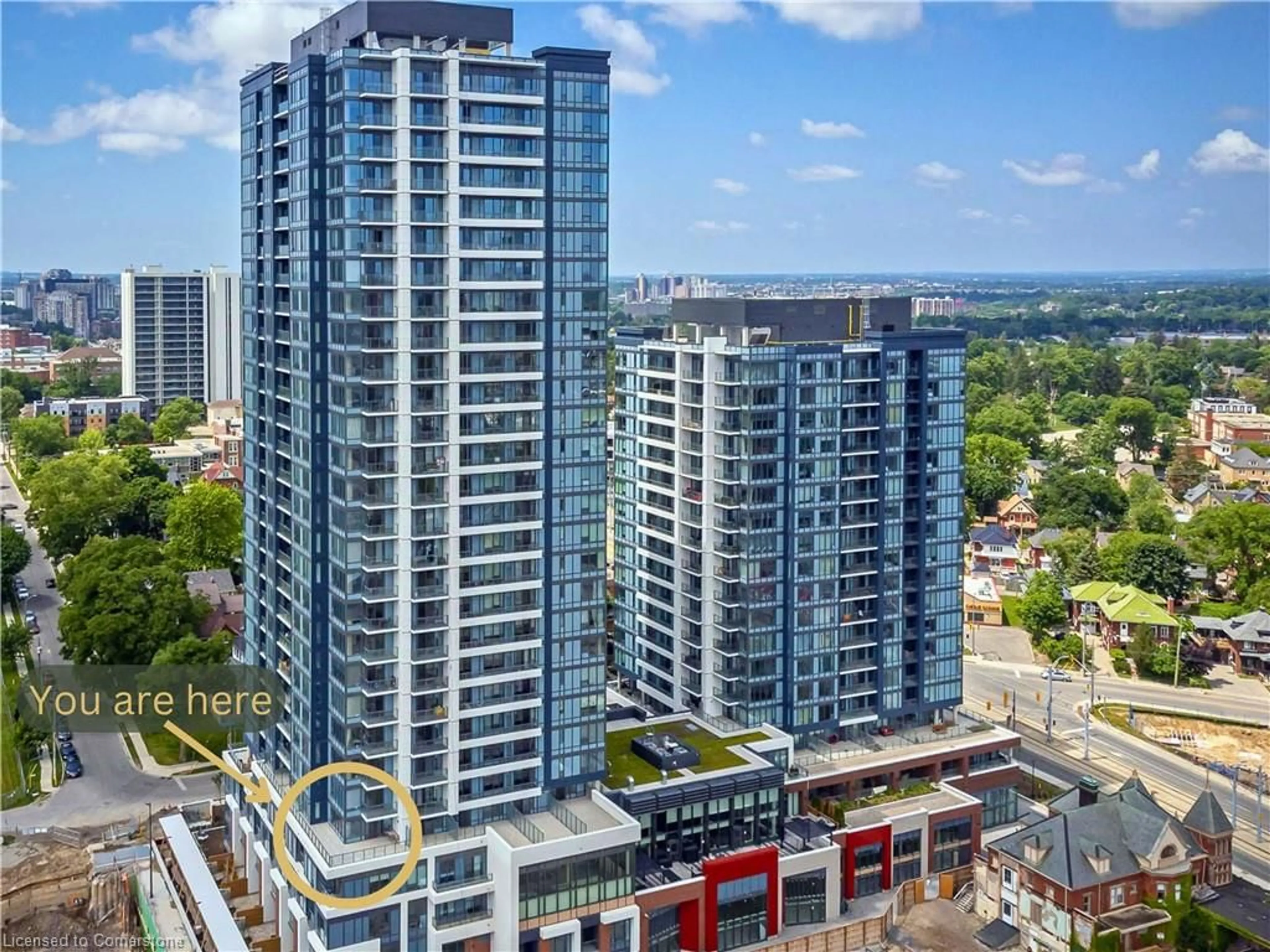 A pic from outside/outdoor area/front of a property/back of a property/a pic from drone, city buildings view from balcony for 15 Wellington St #406, Kitchener Ontario N2G 0E4