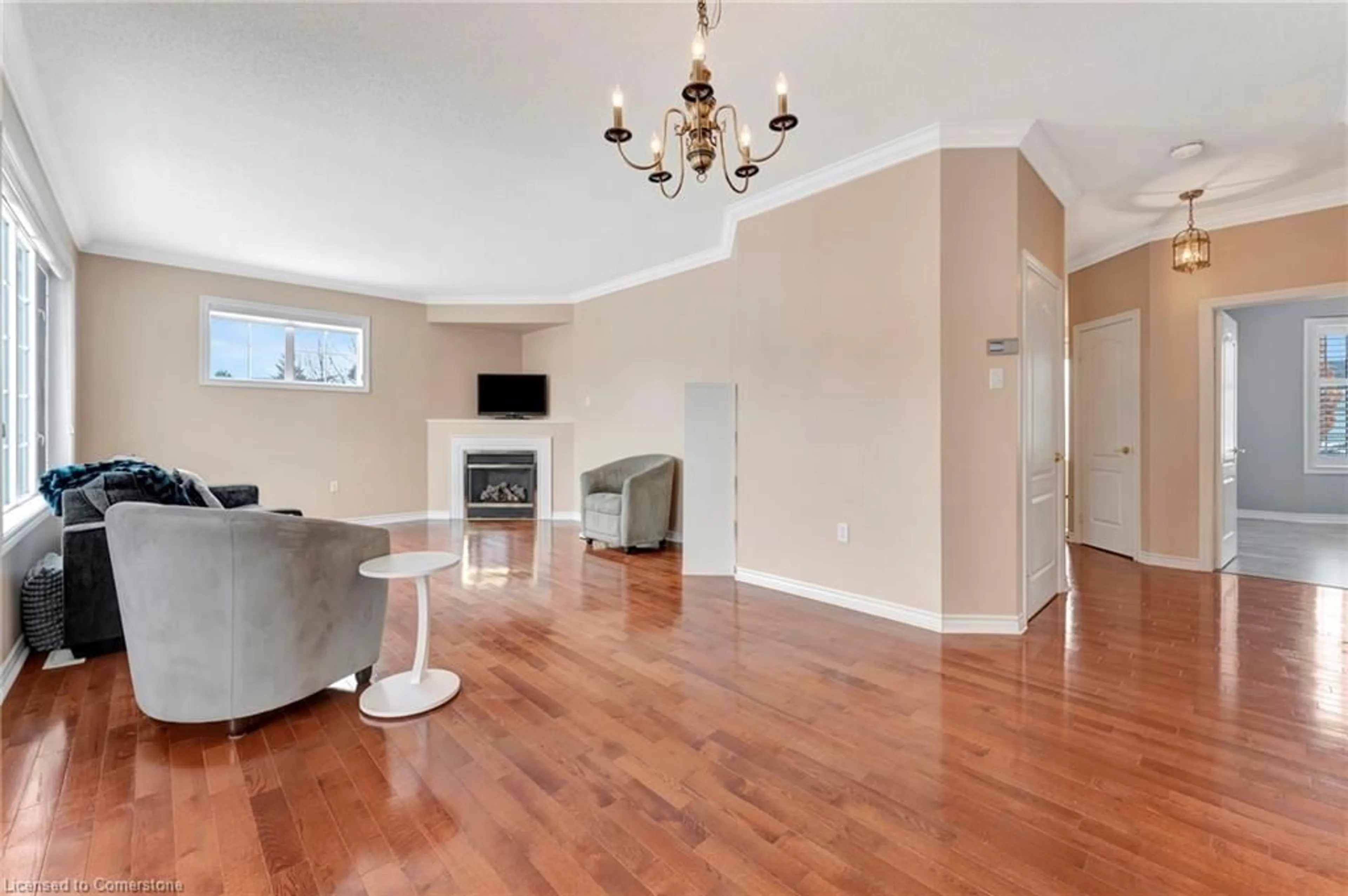 Living room with furniture, wood/laminate floor for 98 Silverbirch Blvd, Mount Hope Ontario L0R 1W0