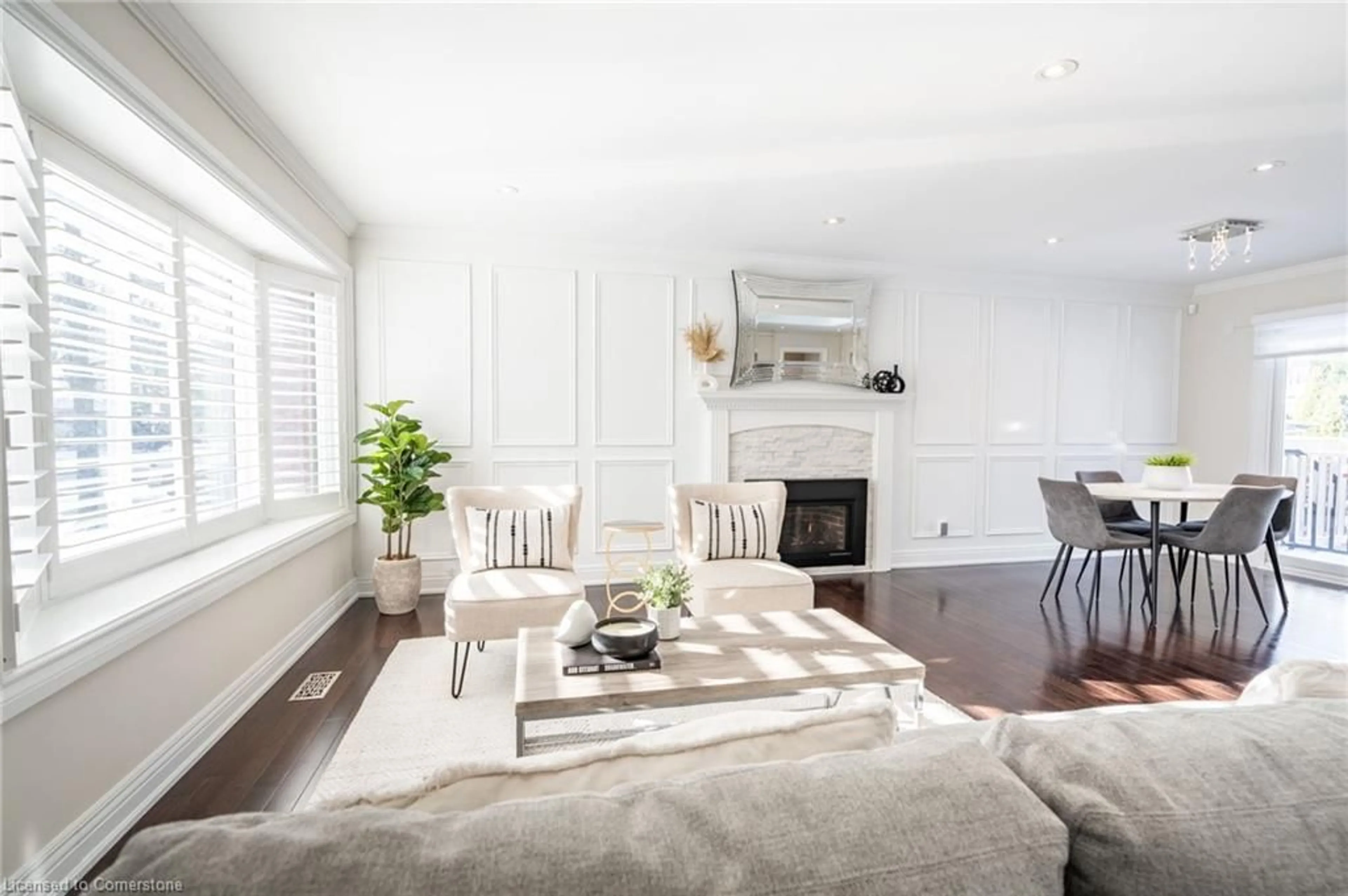 Living room with furniture, wood/laminate floor for 5247 Spruce Ave, Burlington Ontario L7L 1N2