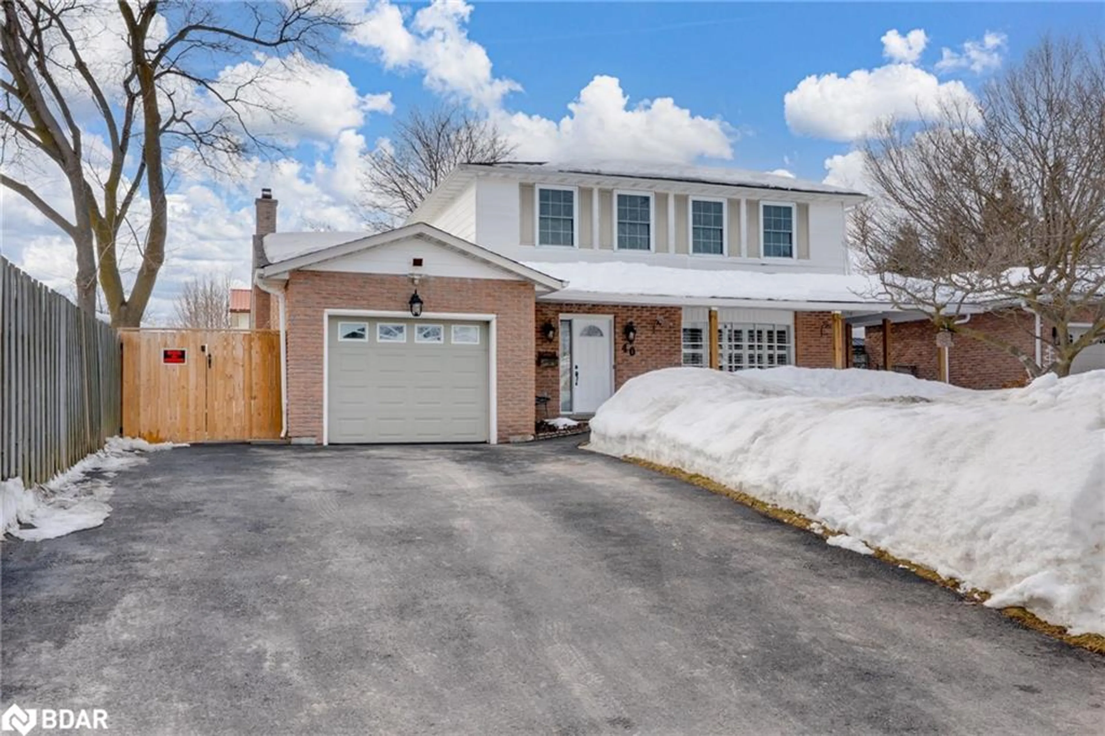 Home with brick exterior material, street for 40 Belcourt Ave, Barrie Ontario L4M 4E4