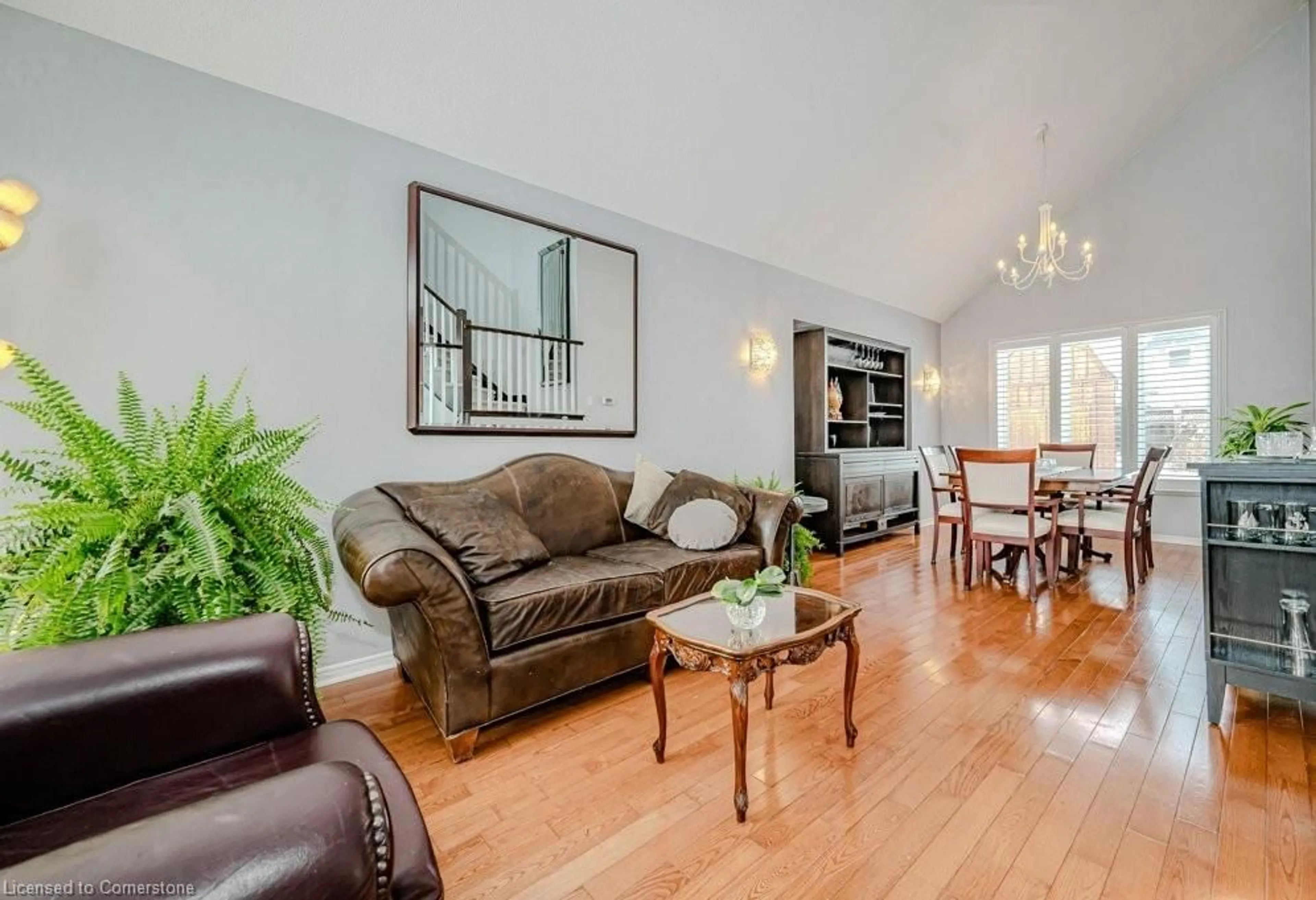 Living room with furniture, wood/laminate floor for 57 Longyear Dr, Waterdown Ontario L8B 0N8