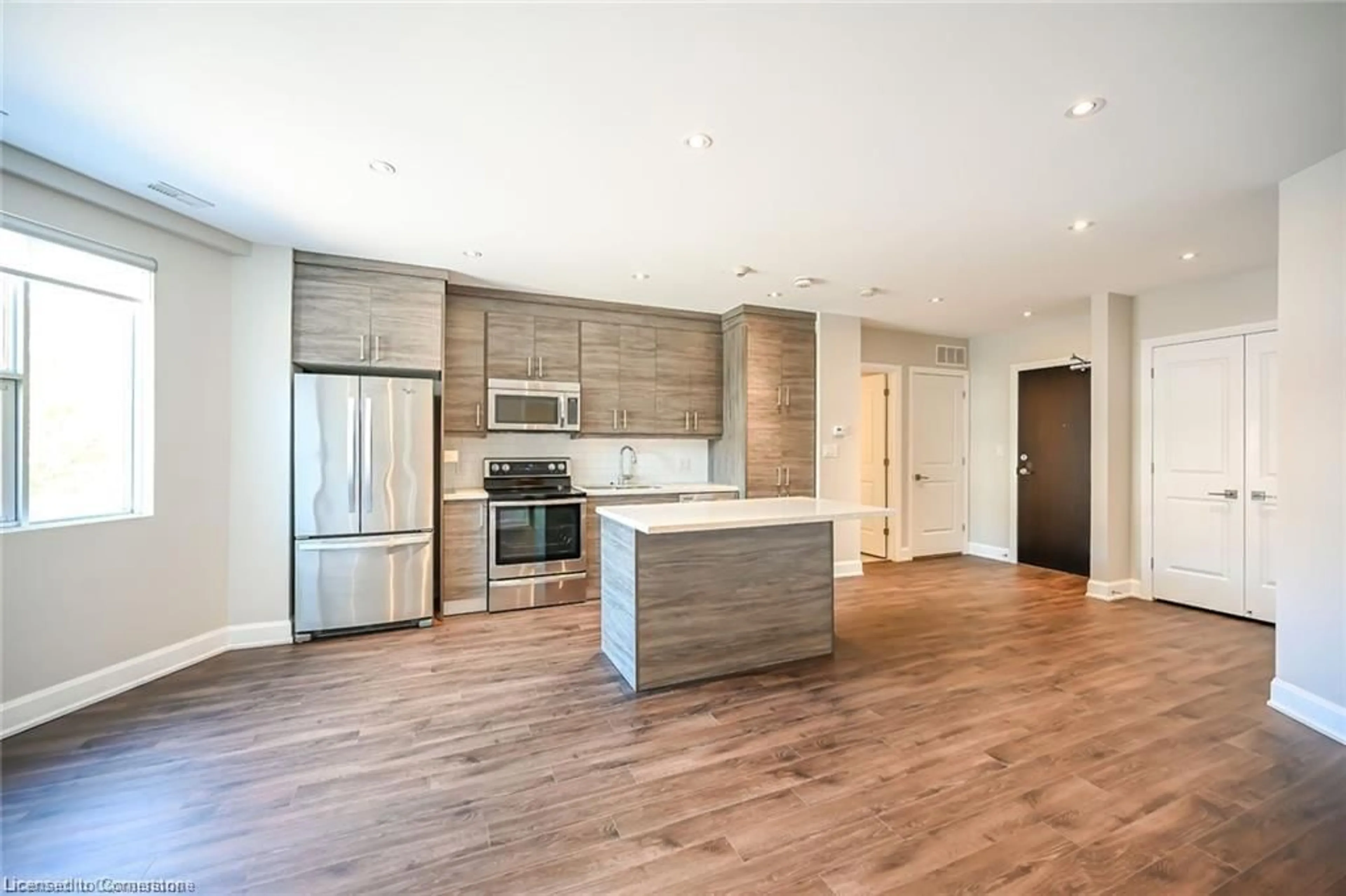 Open concept kitchen, wood/laminate floor for 2 King St #208, Dundas Ontario L9H 6Z1