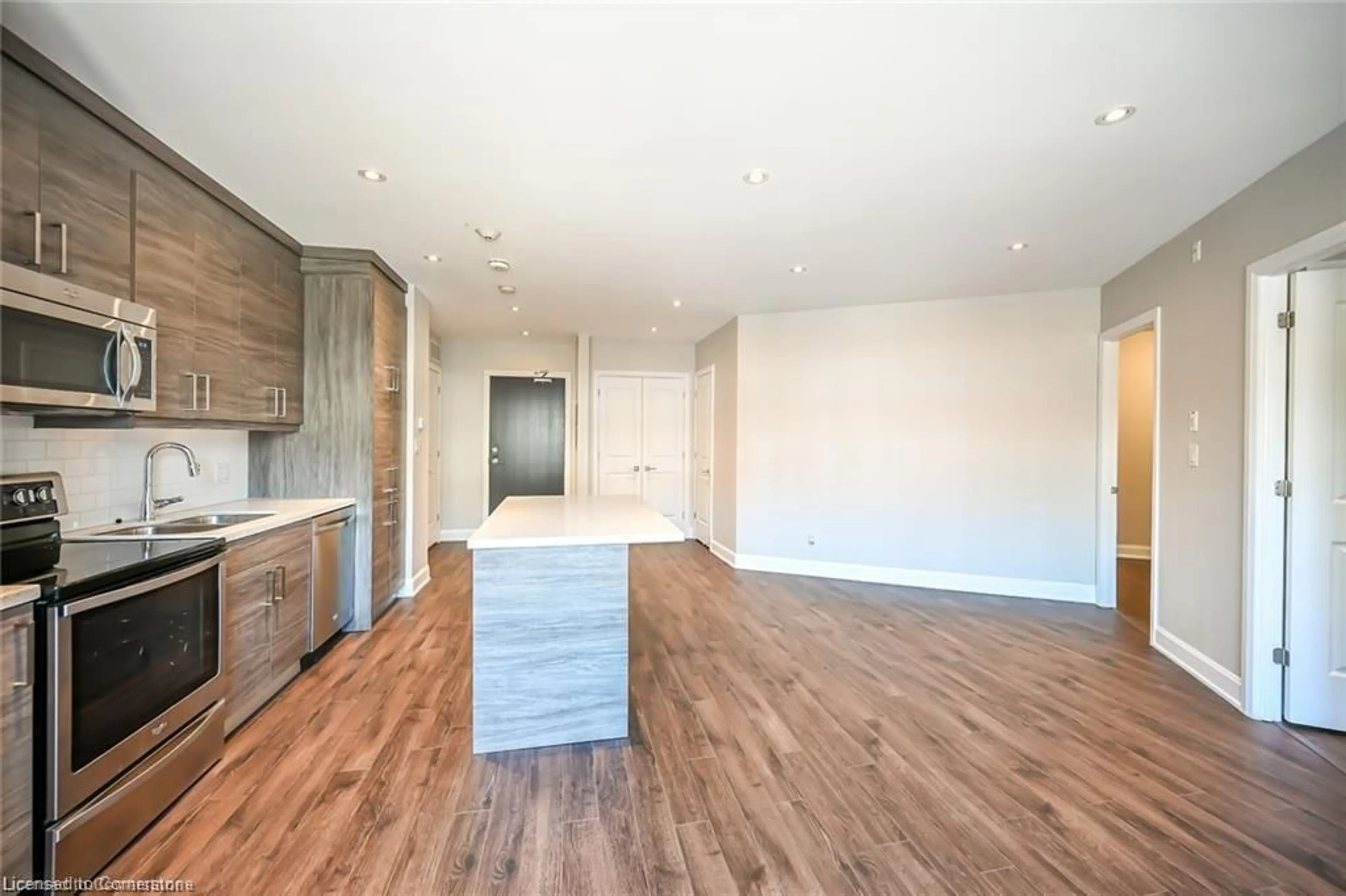 Open concept kitchen, wood/laminate floor for 2 King St #208, Dundas Ontario L9H 6Z1