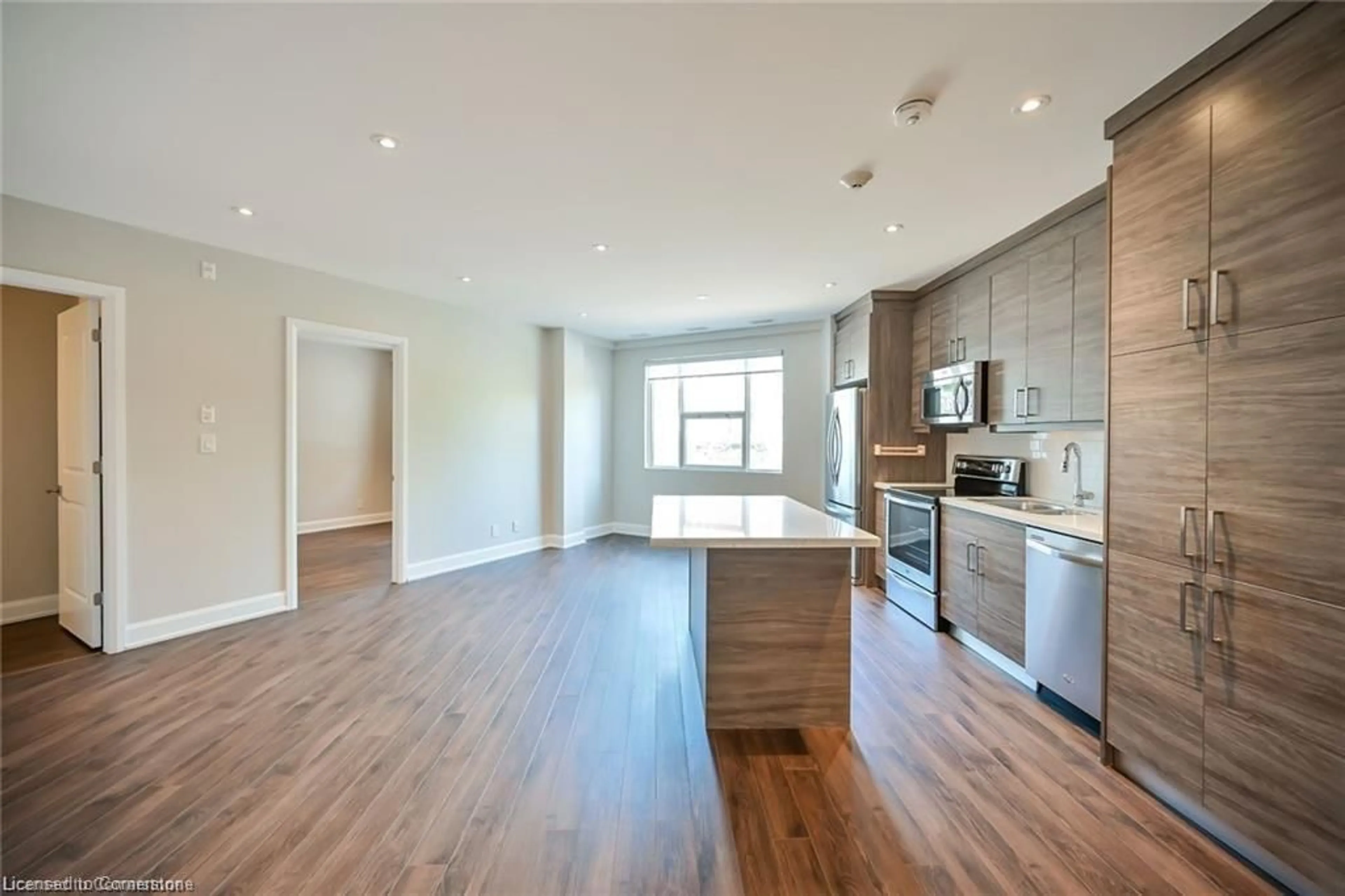 Open concept kitchen, wood/laminate floor for 2 King St #208, Dundas Ontario L9H 6Z1