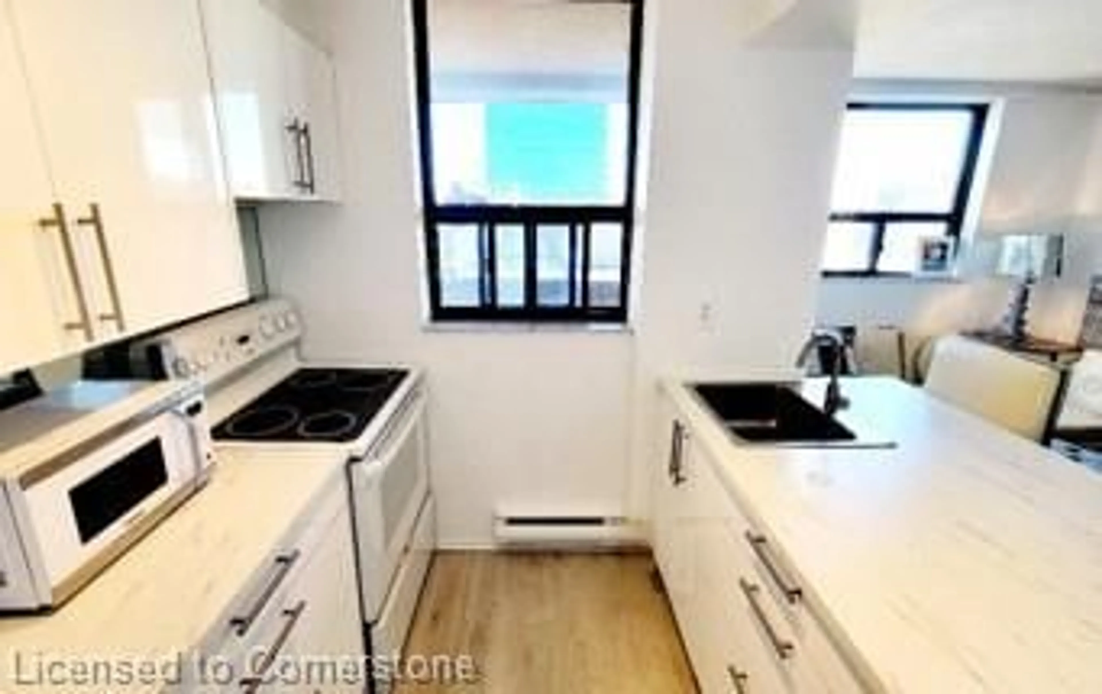 Standard kitchen, wood/laminate floor for 105 Mccaul St #701, Toronto Ontario M5T 2X4