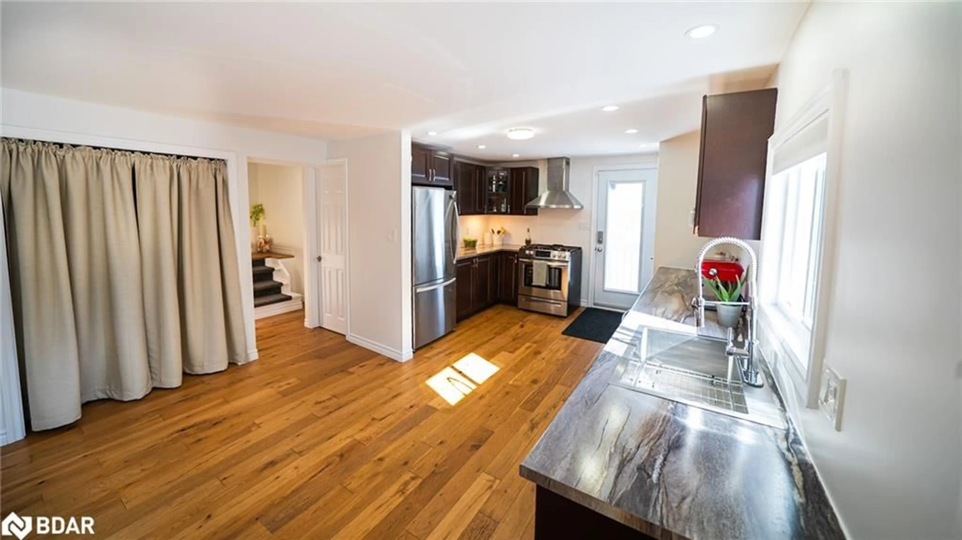 Open concept kitchen, wood/laminate floor for 168 Victoria St E St, North Bay Ontario P1B 1P4