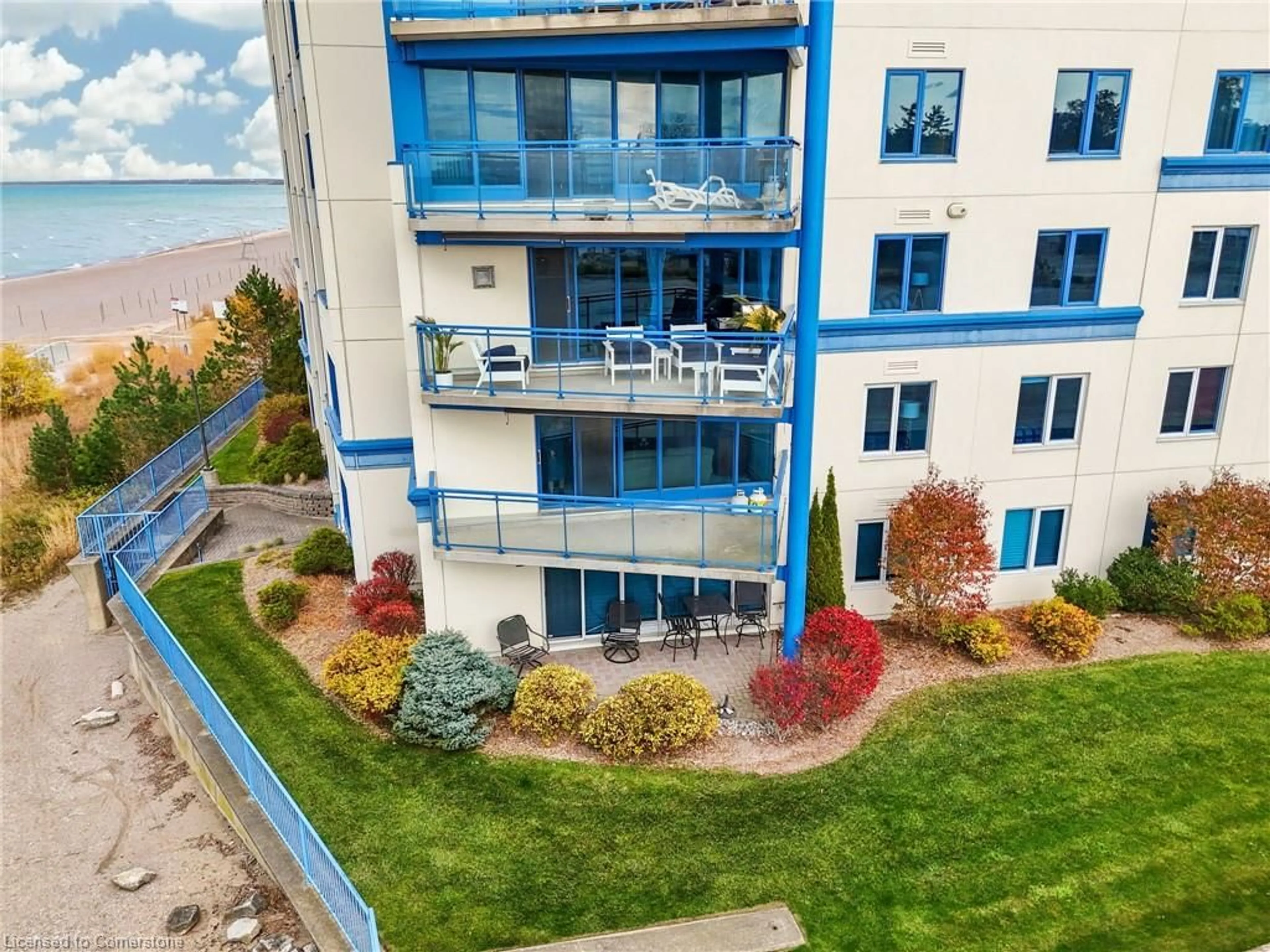 A pic from outside/outdoor area/front of a property/back of a property/a pic from drone, water/lake/river/ocean view for 9 Pine St #202, Grand Bend Ontario N0M 1T0