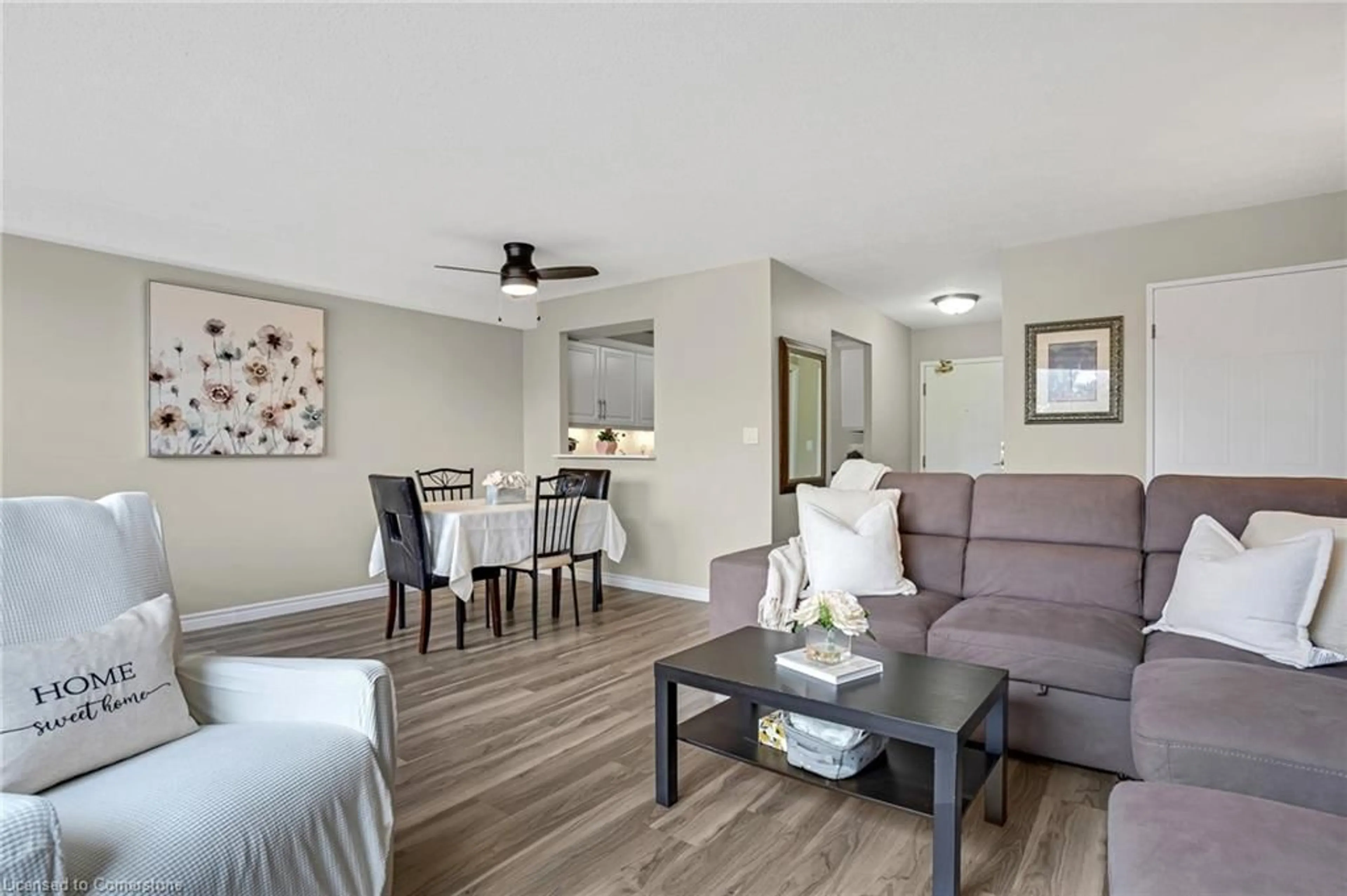 Living room with furniture, wood/laminate floor for 18 Holborn Crt #202, Kitchener Ontario N2A 4A1