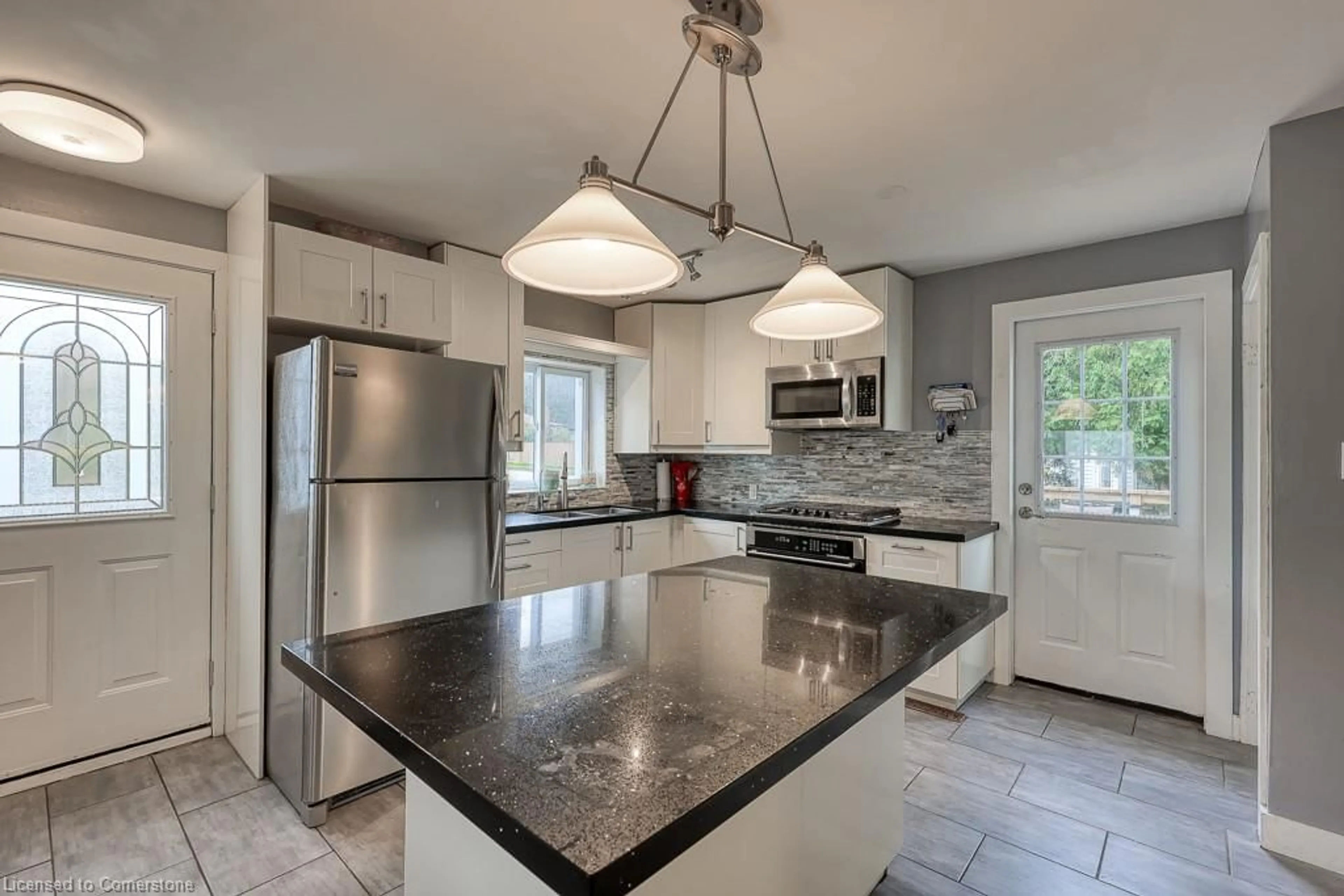 Open concept kitchen, ceramic/tile floor for 42 Henry St, Cambridge Ontario N1R 3W4