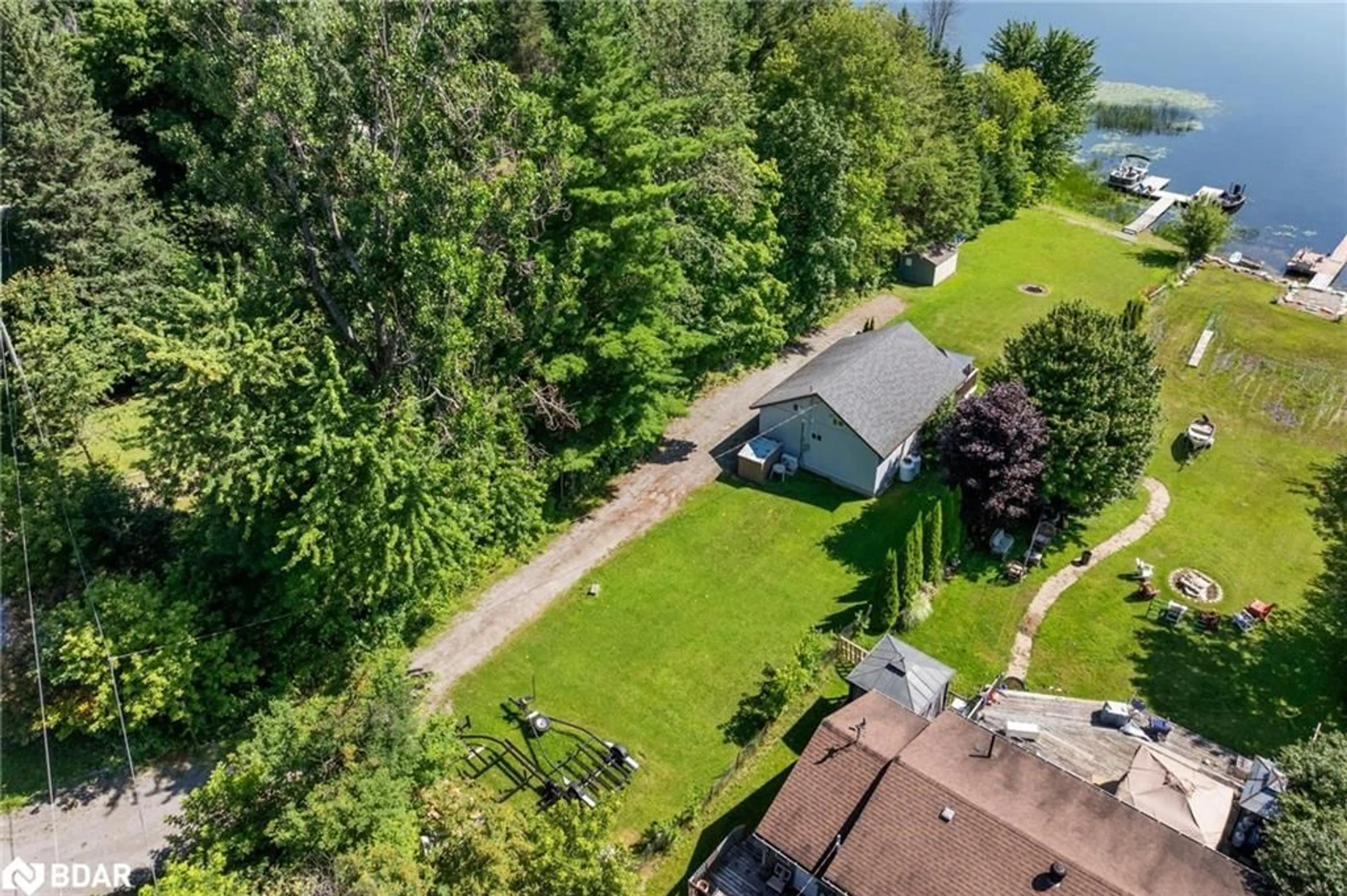 A pic from outside/outdoor area/front of a property/back of a property/a pic from drone, unknown for 104 Fulsom Cres, Carden Ontario L0K 1W0