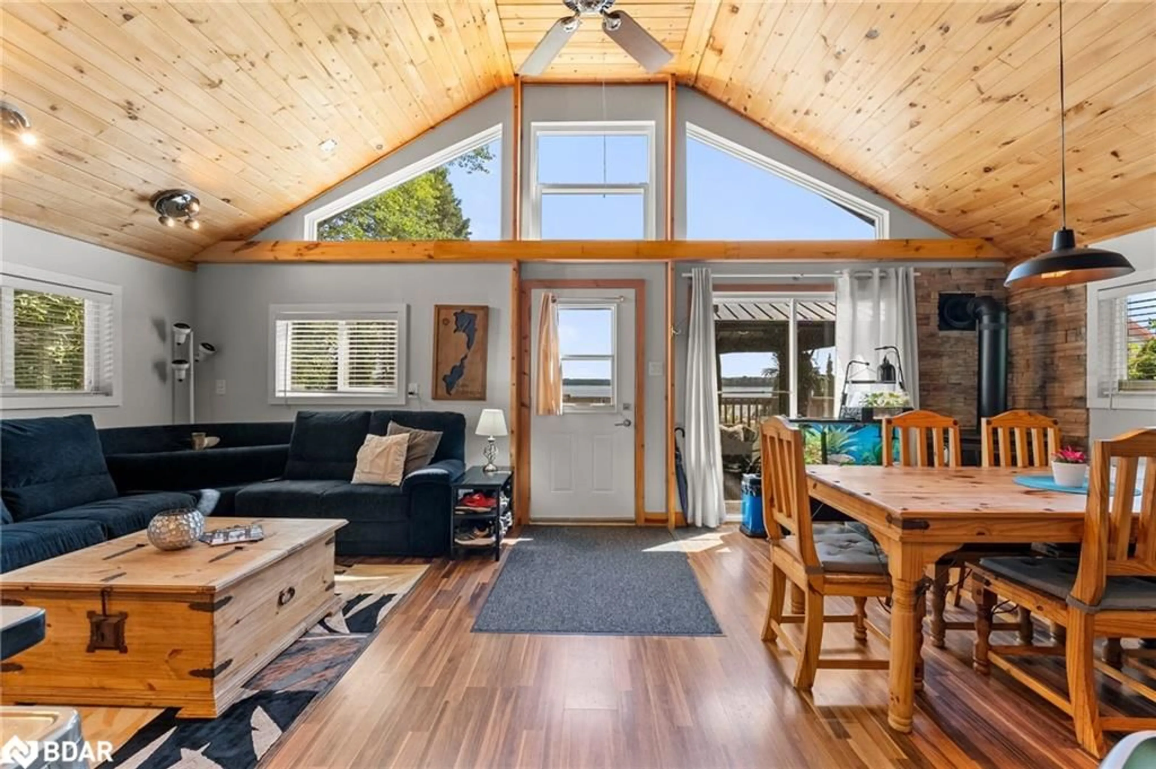 Living room with furniture, wood/laminate floor for 104 Fulsom Cres, Carden Ontario L0K 1W0