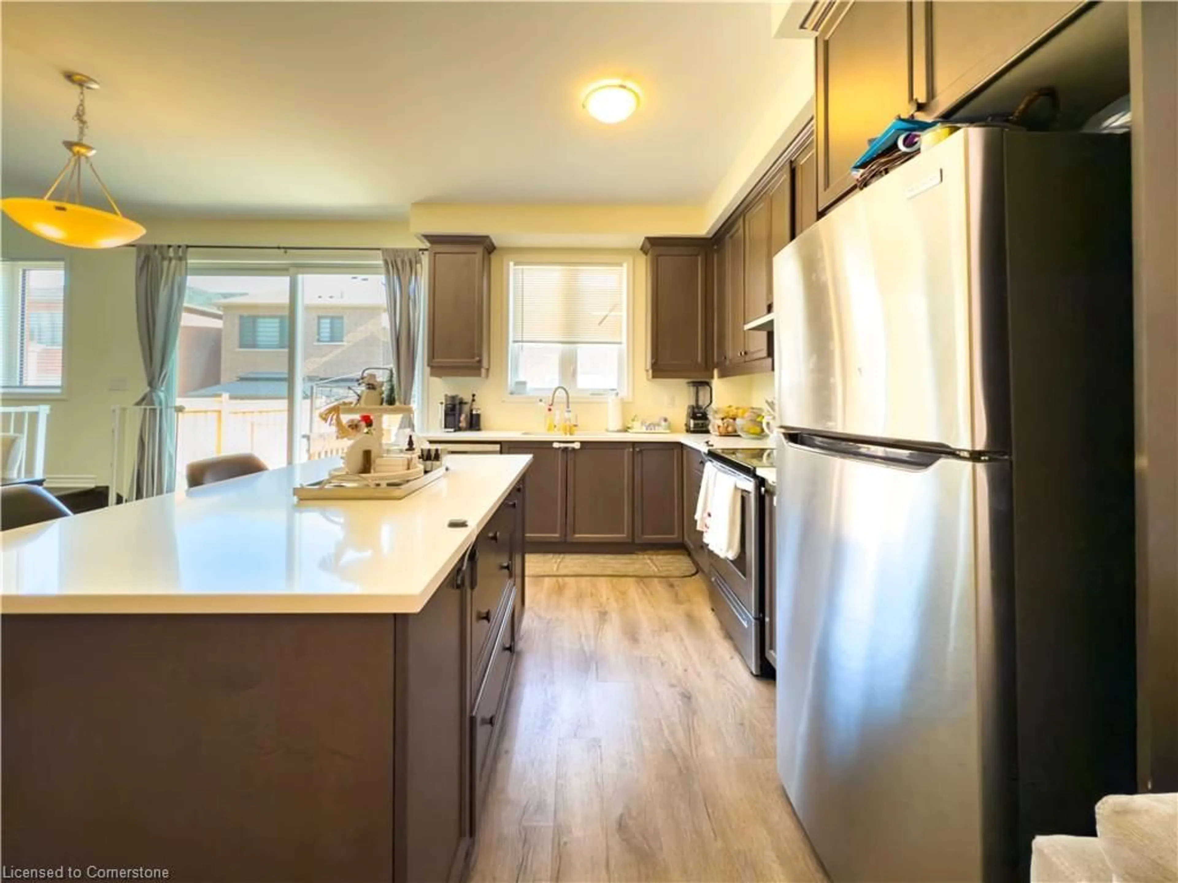 Open concept kitchen, wood/laminate floor for 888 Sumac Cres, Milton Ontario L9E 1R7