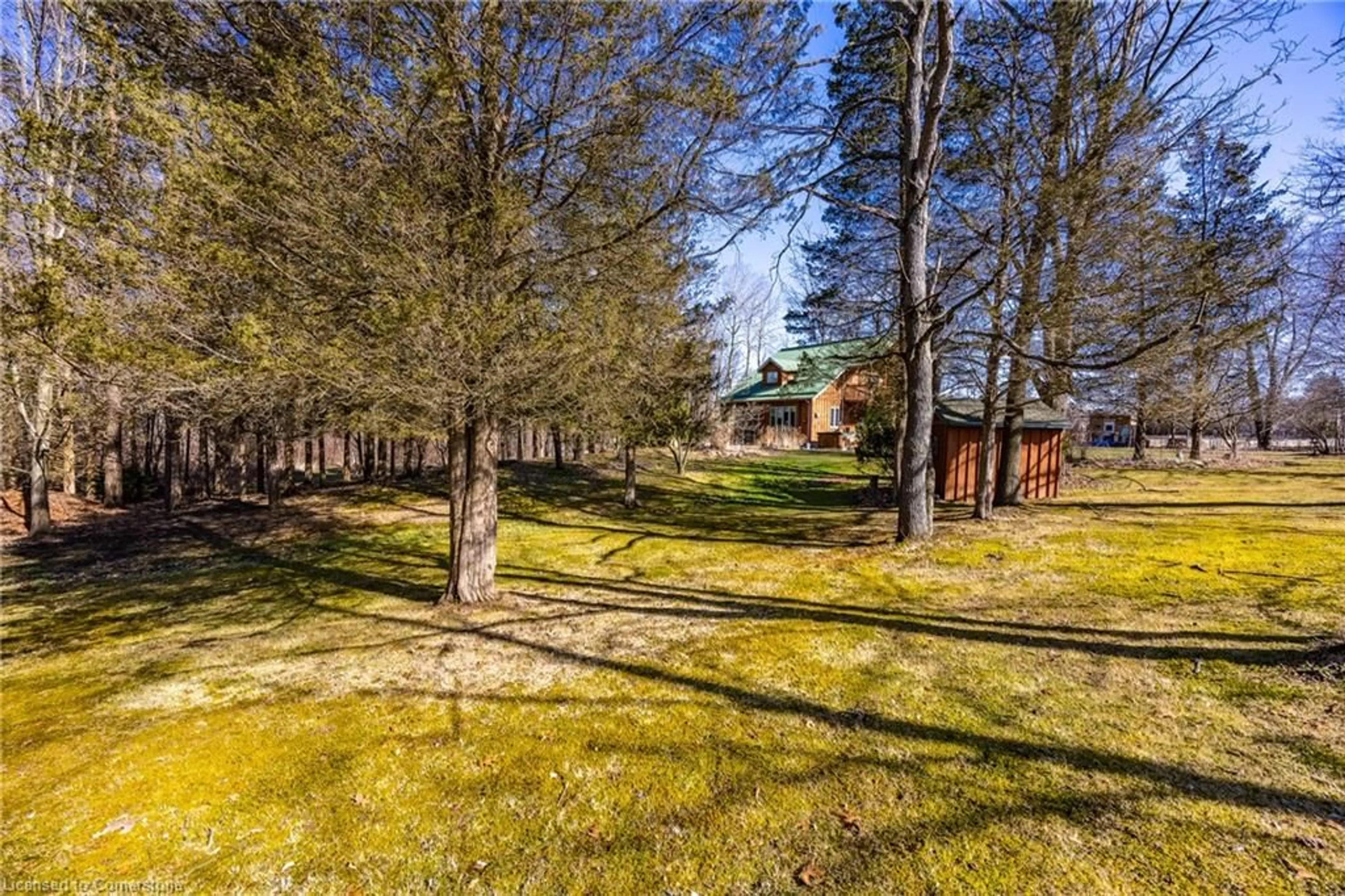 A pic from outside/outdoor area/front of a property/back of a property/a pic from drone, forest/trees view for 1859 4th Concession Rd, St. Williams Ontario N0E 1P0